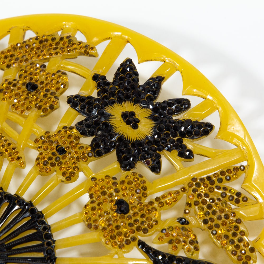 Three Art Deco Jeweled Hair Combs: Three Art Deco jeweled hair combs, first quarter of 20th century, comprising a comb with faux mosaic winged crest signed illegibly to reverse "Franck" (?), an Egyptian Revival inspired jeweled lotus b