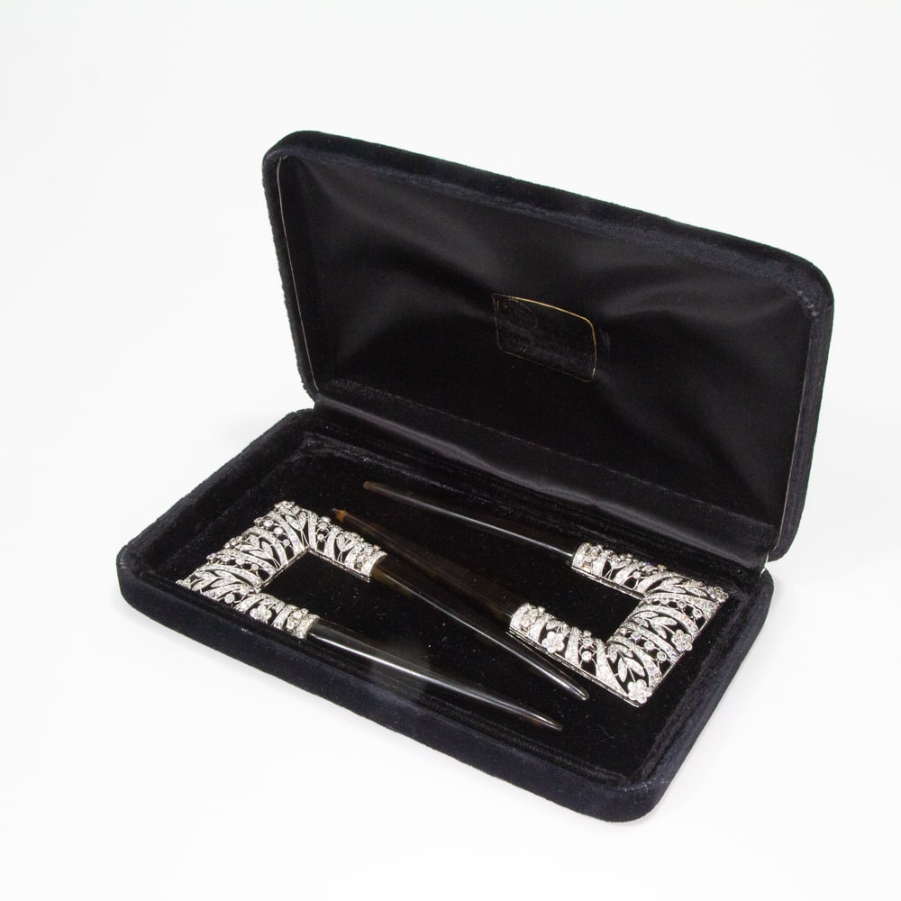 Tiffany & Co. Belle Epoque Diamond & Platinum Pins: Pair of Tiffany & Co. late Belle Epoque to early Art Deco diamond and platinum hairpins, circa 1910, the rectangular frame with pierced stylized flower buds defined by 444 old mine cut diamonds with m