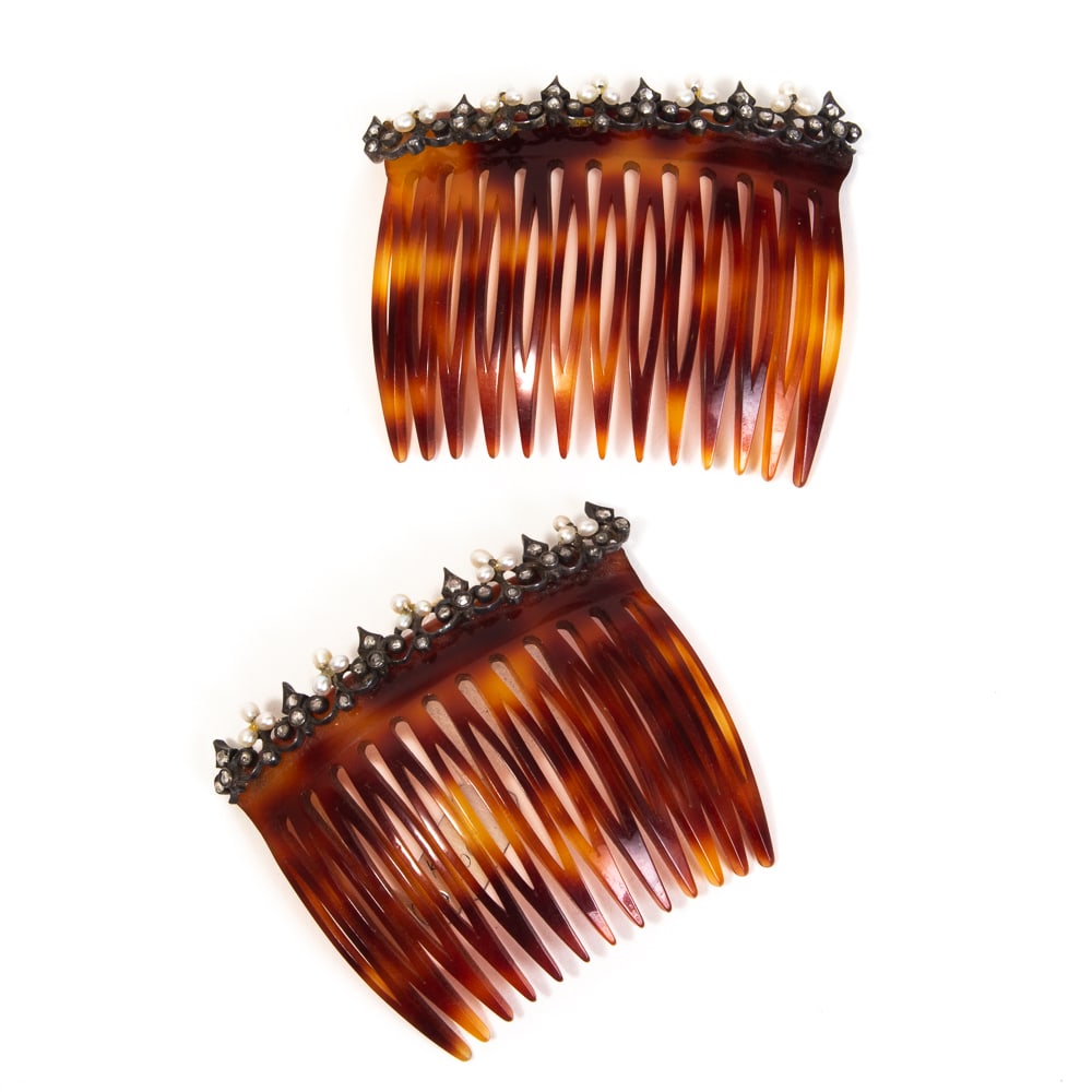 Pair of Seed Pearl & Diamond Hair Combs: Pair of seed pearl and diamond hair combs, decoration probably last quarter 19th century remounted on to later combs, the silver topped gold band with alternating seed pearl rosettes and scrolling fra
