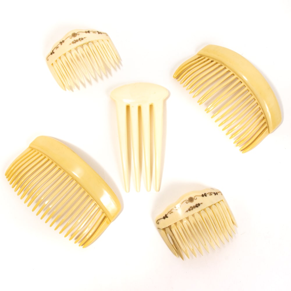 Collection of 5 Vintage Celluloid Hair Combs: Collection of five vintage celluloid hair combs, late 19th-early 20th century, comprising a pair of pique decorated small combs, a simple pair of wide combs, and a single small comb with elongated tin