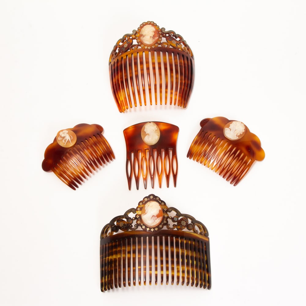 Collection of 5 Antique French Cameo Hair Combs: Collection of five antique cameo hair combs, 19th-20th century, including a pair of large combs with gold pique foliate decorations on pierced crests, together with three smaller combs all marked "Fra