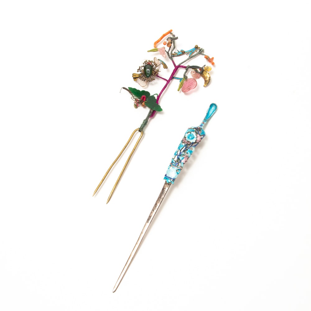 Chinese Silver Enamel Floral Hairpin & 1 Other, 2: Two hairpins, including a Chinese silver enamel floral hairpin, late 19th-early 20th century, the single pick mounted with a blue and purple enamel floral bouquet in an urn, with marks to reverse. Tog