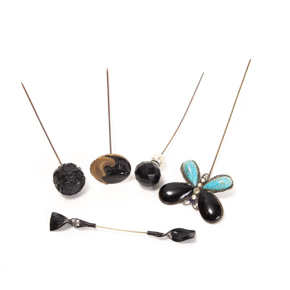 Collection of 5 Decorative Hairpins / Hat Pins: Collection of decorative hairpins / hat pins, late 19th-mid 20th century, including a metal butterfly pin featuring turquoise and black onyx cabochon wings, a rondelle pin with black enamel bird relie