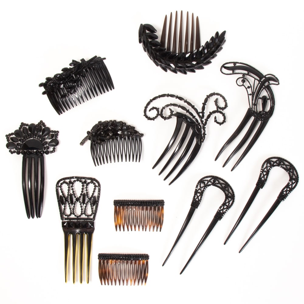Group of 11 Victorian French Jet Mourning Combs: Group of 11 Victorian French jet mourning hair combs, 19th-early 20th century, including a pair of pierced horseshoe form combs; two ornate asymmetrical feathered combs; two with elaborate pierced cre