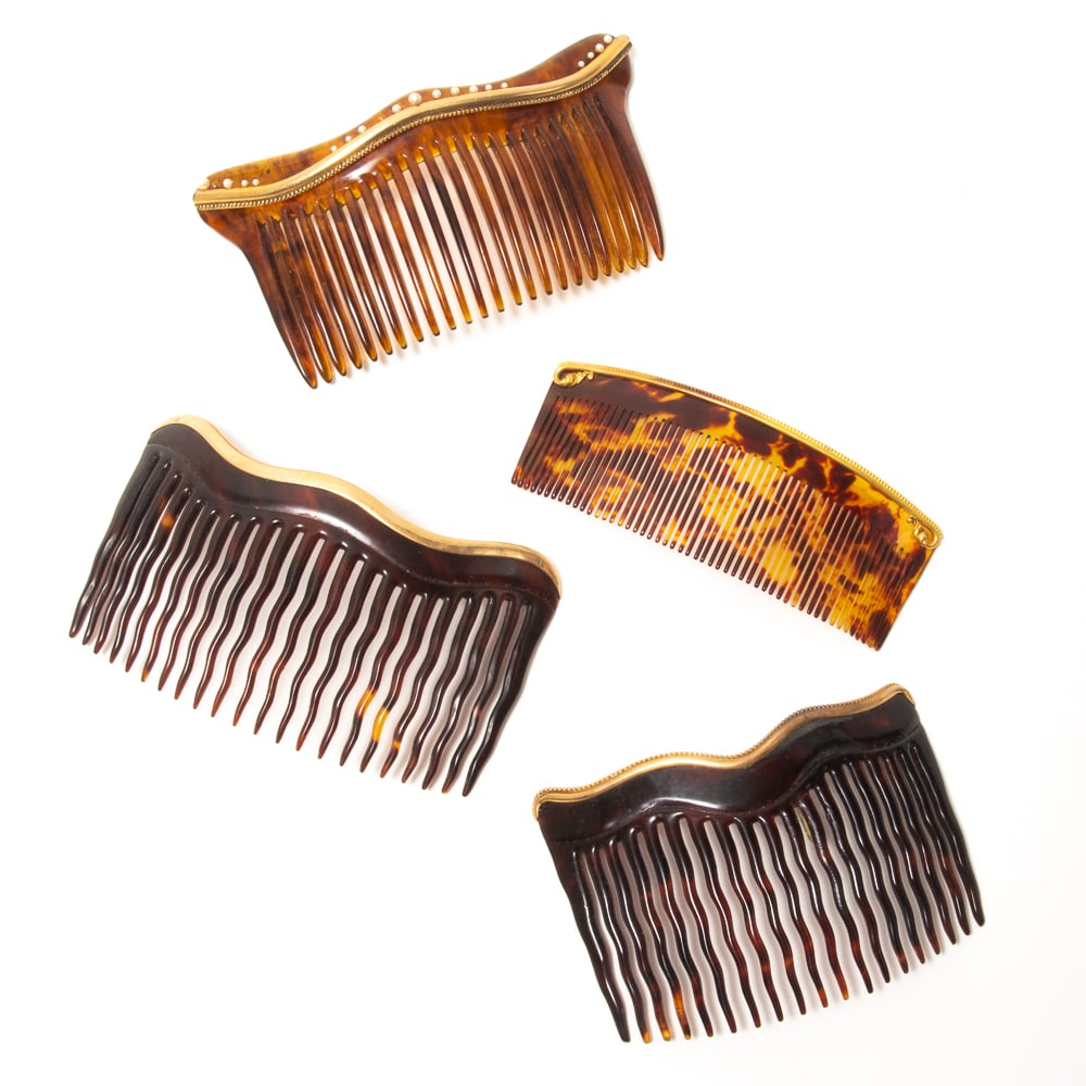 Group of 4 Antique 14K Gold Mounted Hair Combs: Group of four antique 14 karat gold mounted hair combs, late 19th-early 20th century, some with marks, all tested, one mounted with seed pearls. [Largest: 2.5" L x 4.5" W]. Overall in good condition, 