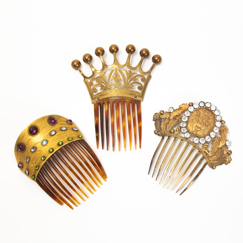 3 Ornate Silver Vermeil & Brass Hair Combs: Group of three ornate silver vermeil and brass hair combs, mid 19th-early 20th century, including a silver vermeil comb with central flower urn medallion surrounded by openwork foliage and paste stone