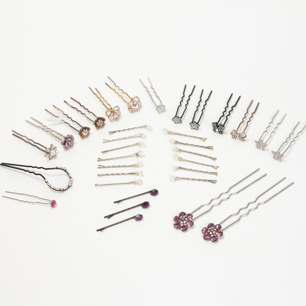 Large Collection of Vintage Hairpins, 33: Large collection of vintage and contemporary hairpins, 20th-21st century, approximately 33 pieces, all having decorative faux gem mounts in various designs. [2-5.25" L]. Overall condition is good.
