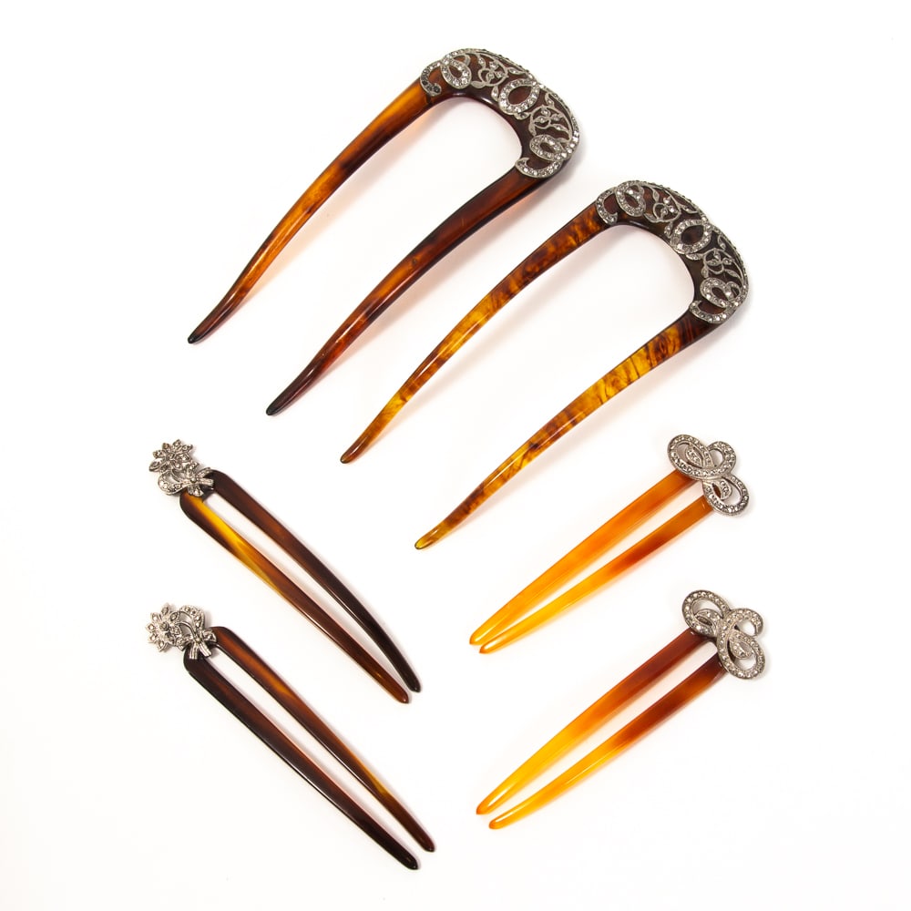 Group of 5 Antique Marcasite Hair Picks: Group of five antique marcasite hair picks, late 19th-mid 20th century, including two pairs and one single, all having intricate designs set with marcasite stones. [Largest: 4.75" L x 2" W]. Overall c