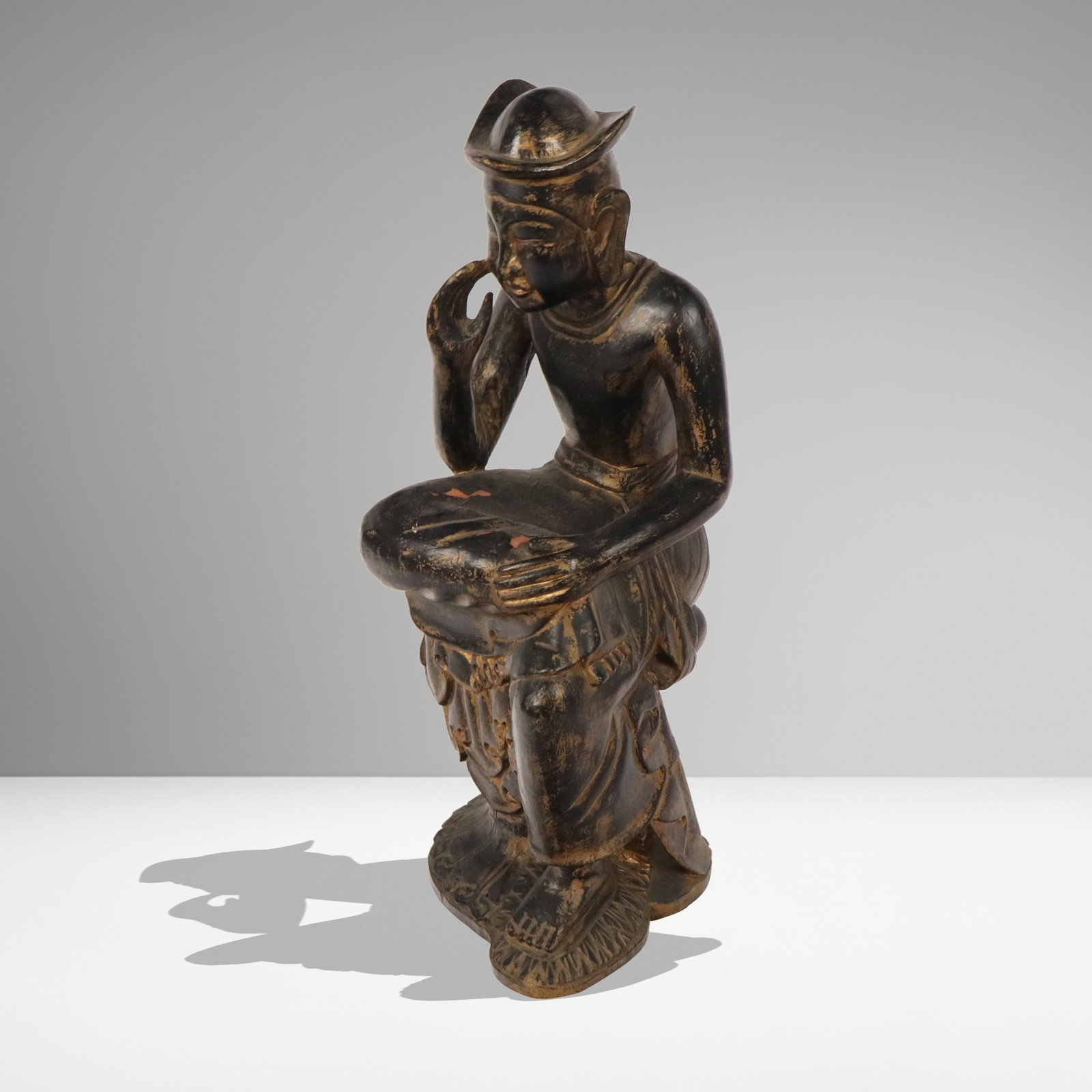Japanese Carved Wood Figure: Japanese carved wood figure, 19th century, depicting a Bodhisattva on a lotus base, with black painted and gilt finish. [32" H x 14" W x 16" D]. Condition is good with lifting and losses to paint at f