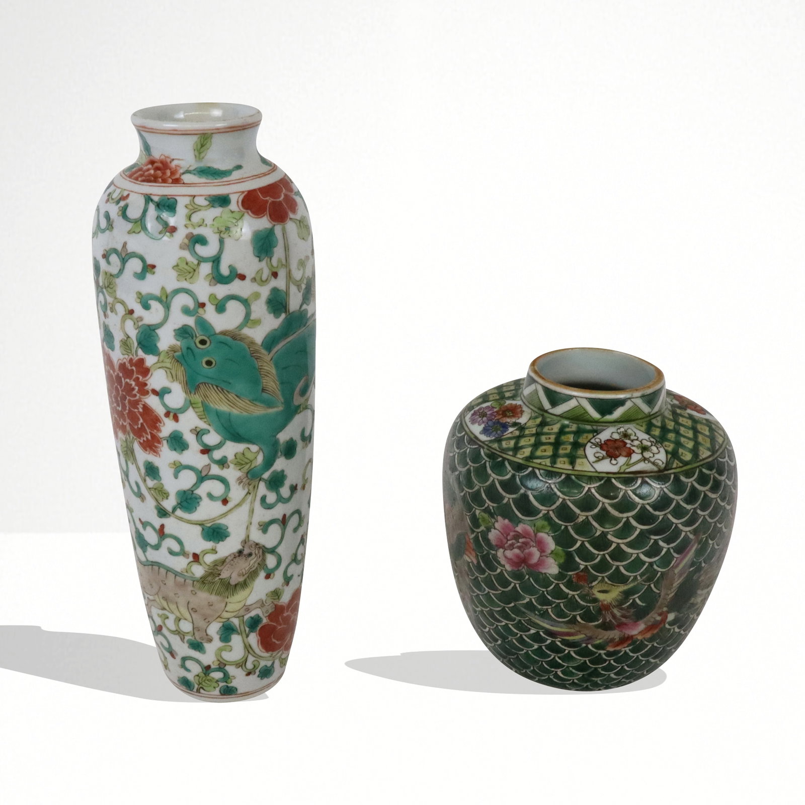 Two Chinese Export Porcelain Vases: Two Chinese export porcelain vases, Qing Dynasty, late 19th/early 20th century, comprising a Famille Rose vase with floral and foo dog decoration and a Famille Verte vase with phoenix decoration, Fami