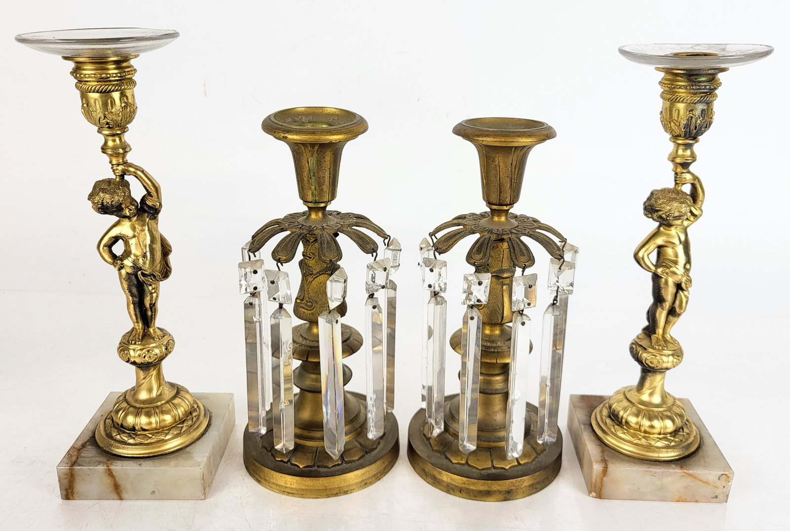 Pair of Gilt Metal Candlesticks: Pair of art nouveau inspired bronze candlesticks with girandole pendants. [Tallest: 10" H x 3.25" Diameter]. Overall is fair, some crystal pendant deficient. Estate of Luara Leonard Ault