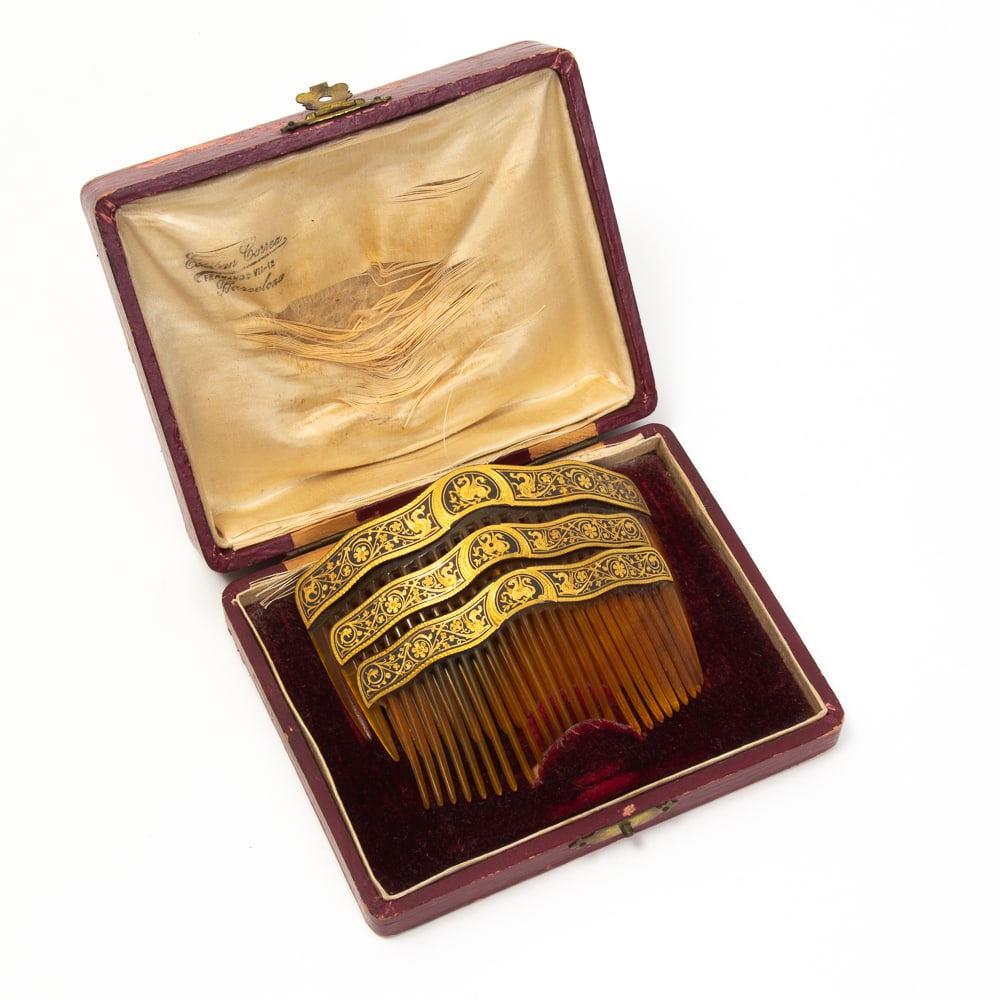 Antique Gold & Enamel Hair Comb: Antique 18 karat gold and black enamel hair comb, French, late 19th century, the shaped crest with zig-zag motif, with French assay mark and illegible makers mark. [Total weight, inclusive: 26.4 dwt.;