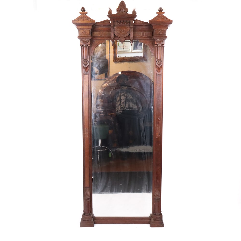 Victorian Eastlake Carved Wood Pier Mirror: Victorian Eastlake carved wood pier mirror, late 19th/early 20th century, with carved floral and column decoration and burlwood details. [82" H x 35" W x 7" D]. Condition is good with some minor wear 
