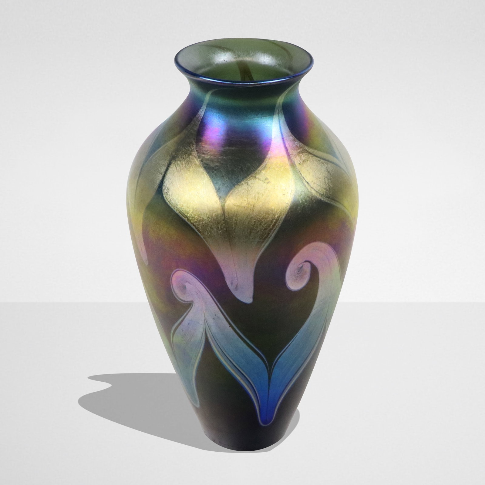 Tiffany Studios Favrile Glass Vase: Louis Comfort Tiffany iridescent Favrile glass vase, circa 1900, the baluster form with aubergine ground offset by bluish and gold swirls, engraved on side of the base Louis C. Tiffany, the underside 