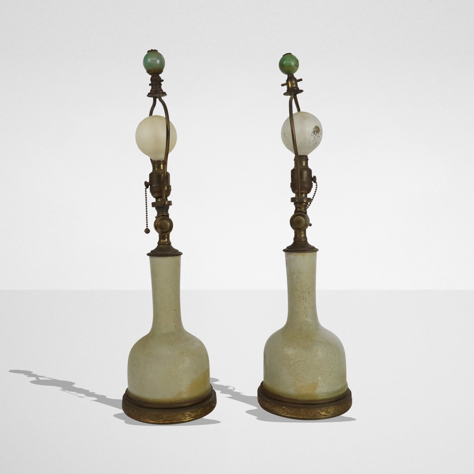Chinese Pair of Porcelain Vases as Lamps: Chinese pair of porcelain vases, 19th century, Qing Dynasty, mounted as lamps with brass bases and hardstone finials. [Including harps: 17.25" H x 5" Diameter]. Condition to each is good to fair with 