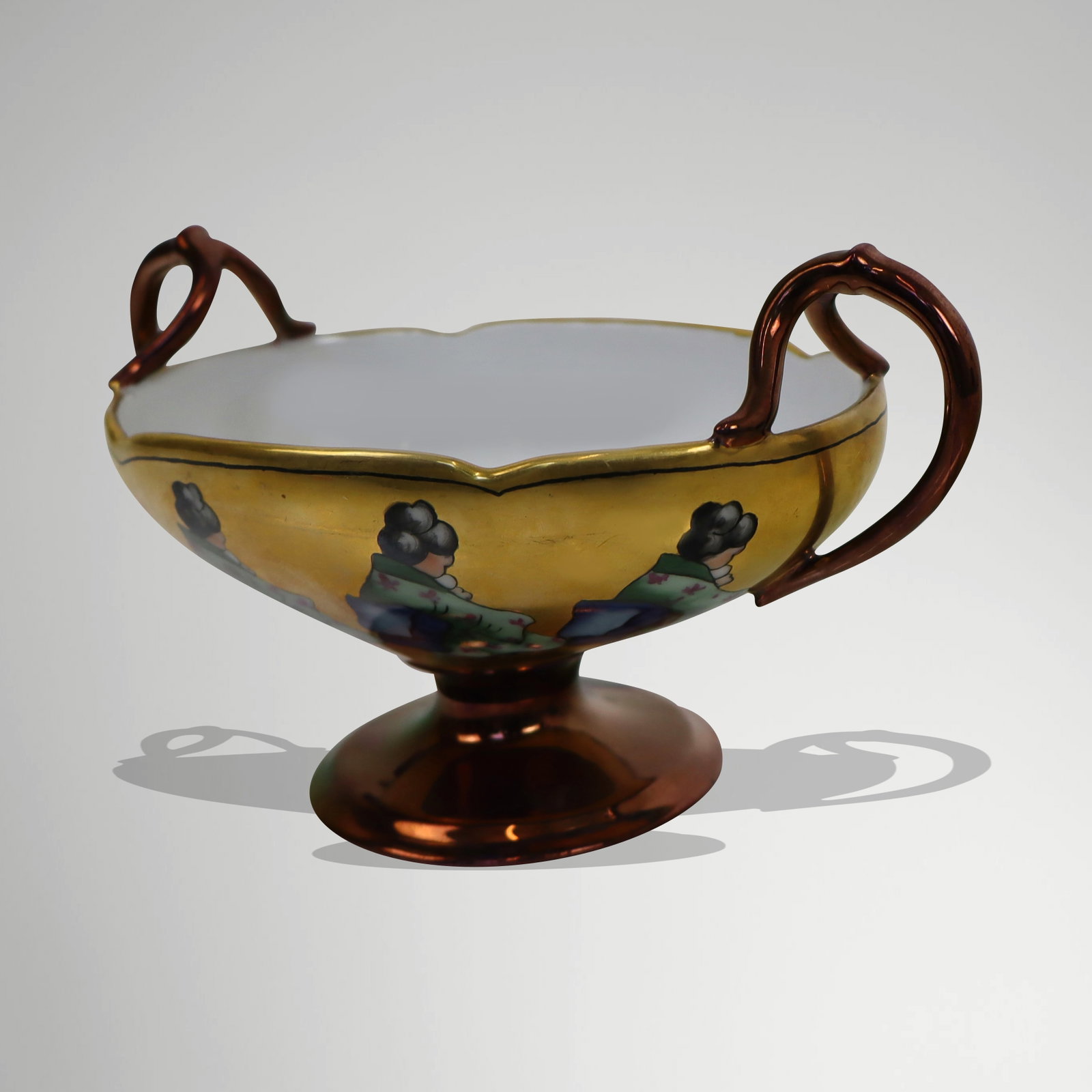 Limoges Japanese Gold Leaf Porcelain Compote: Limoges porcelain compote having hand-painted Geisha all-around decoration set on gold leaf with scrolling handles, on pedestal base. Provenance: From the Estate of Dr Robert Reber, Greenwich, CT. [4"