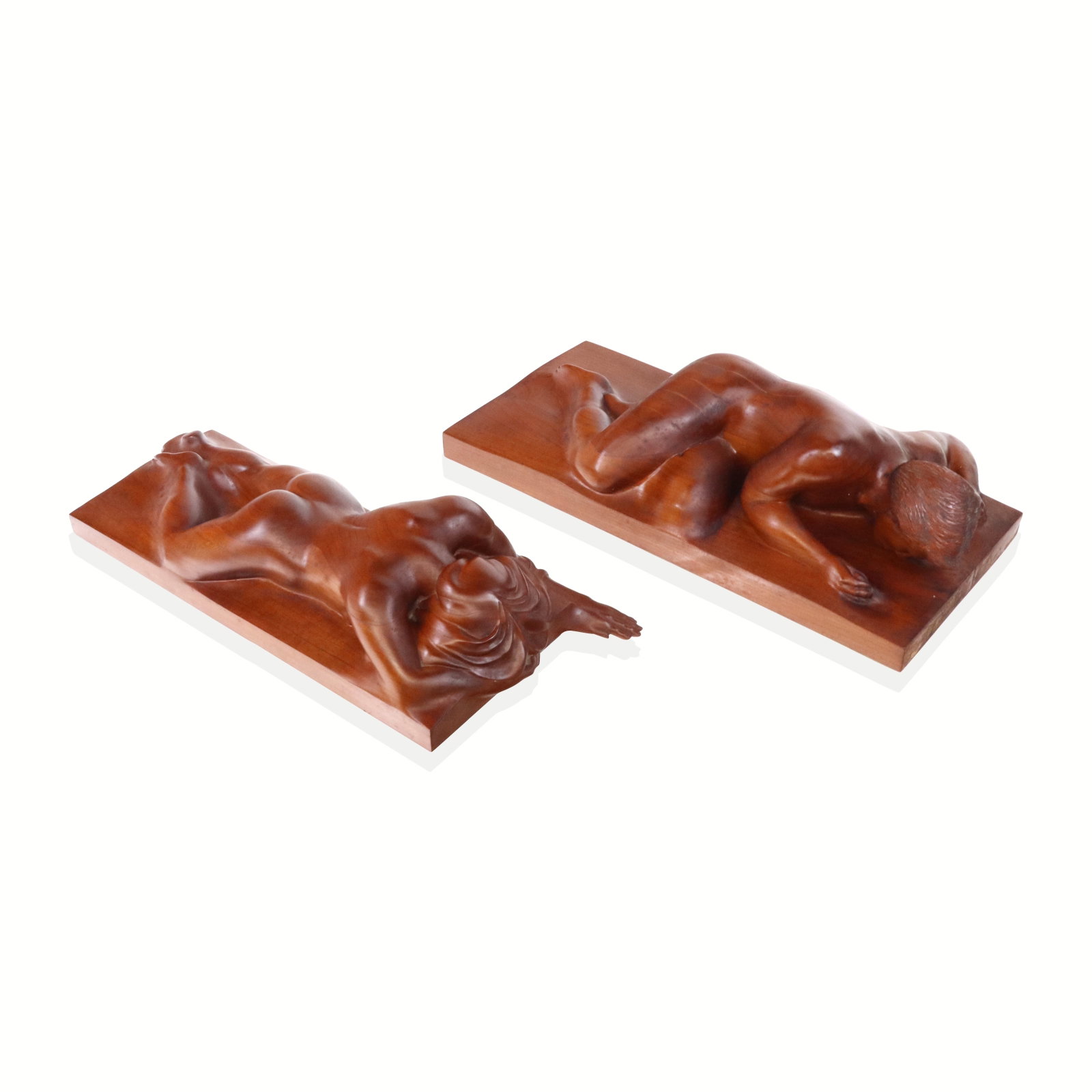 Haywood NIHOLS Carved Figural Sculptures, 2: Haywood Nichols (American, 1938-2022) companion pair of carved figural wall sculptures of a man nand woman, each prone, commissioned by Robert F Simmons, etched on reverse and dated. [Man: 23" H x 10.