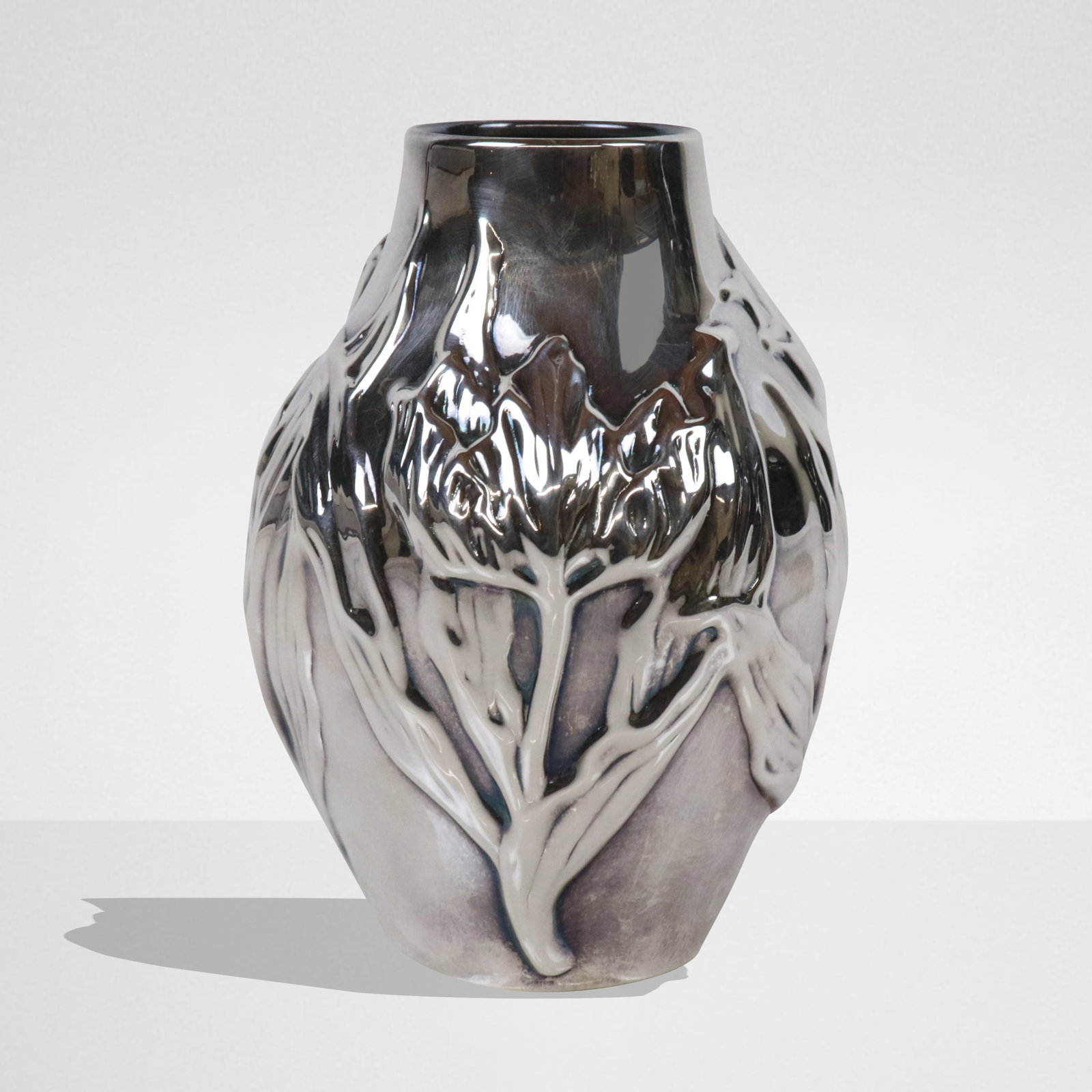 Tiffany & Co. Louis Comfort Tiffany Silver Vase: Tiffany & Co. sterling silver "Louis Comfort Tiffany" tulip decorated bud vase, Italian, marked on the underside of base.. [5 ozt.; 5" H x 3.5" Diameter]. Overall condition is good.