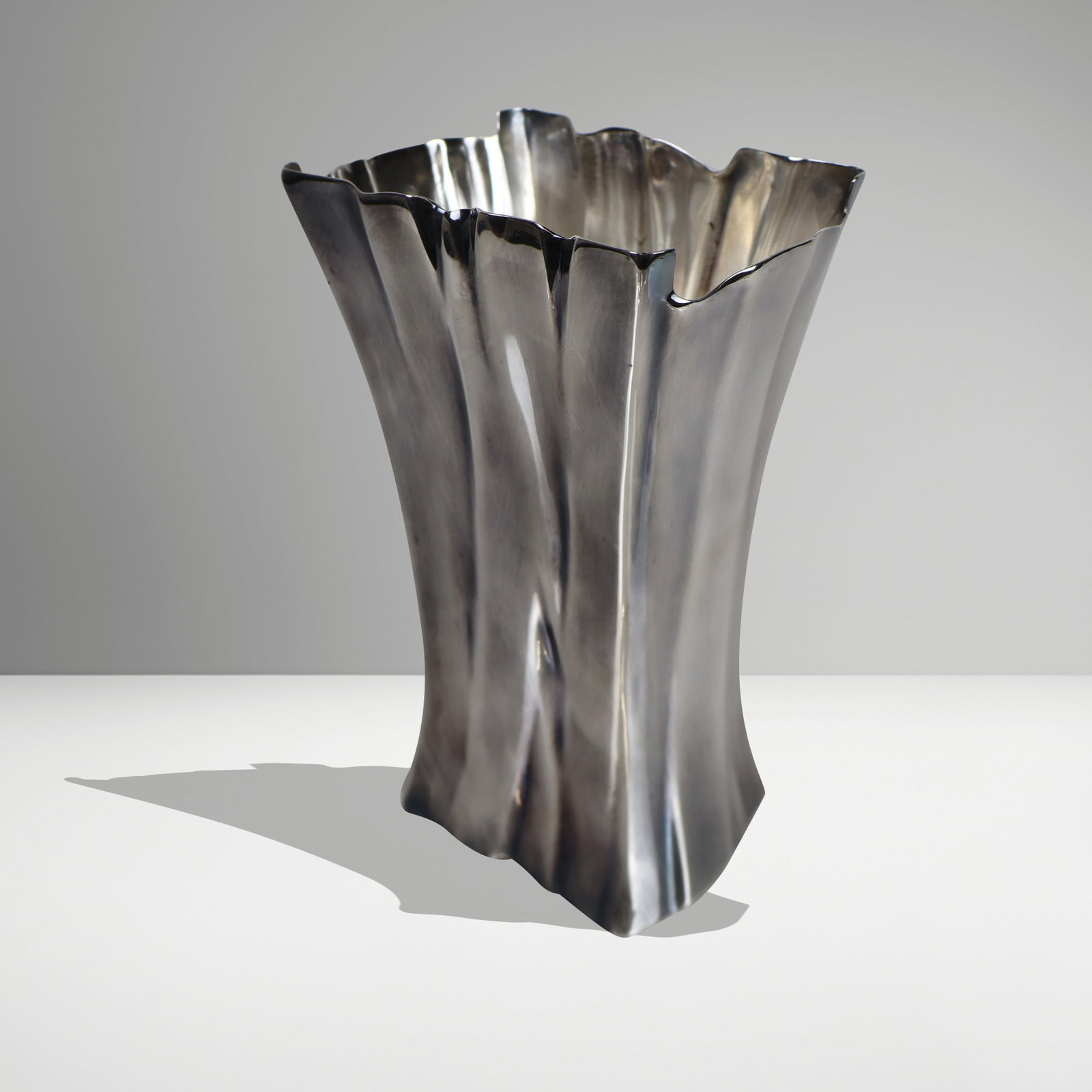Tiffany & Co. "Louis Comfort Tiffany" Silver Vase: Tiffany & Co. sterling silver "Louis Comfort Tiffany Collection" freeform vase with blued finish, marked on underside of base. [23 ozt.; 8.25" H x 5.5" W x 3.25" D]. Overall condition is good.