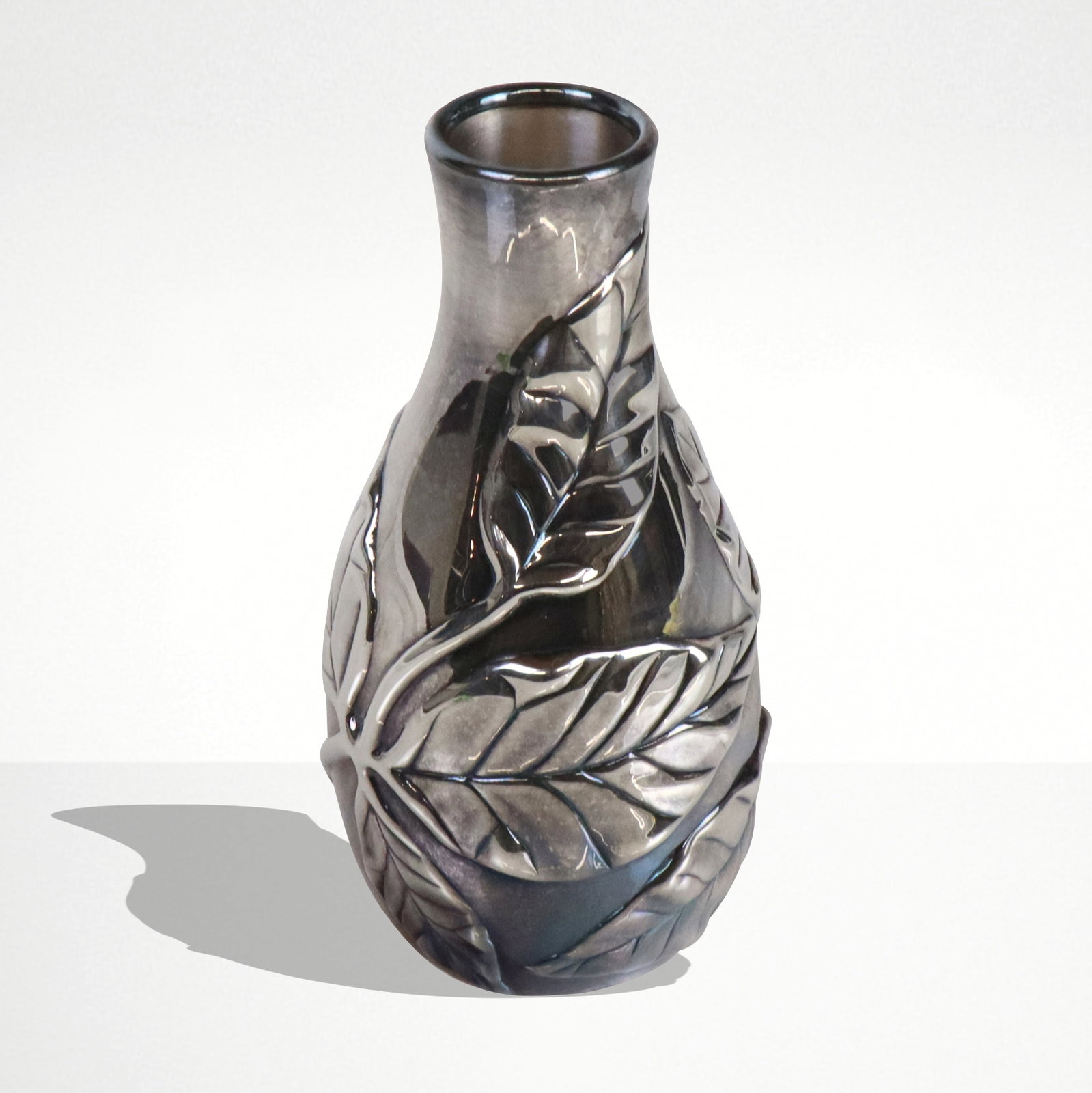 Tiffany & Co. "Louis Comfort Tiffany" Silver Vase: Tiffany & Co. sterling silver "Louis Comfort Tiffany" leaf decorated bud vase, marked on underside of base. [4 ozt., 5" H x 2.5" Diameter]. Overall condition is good, some tarnishing.