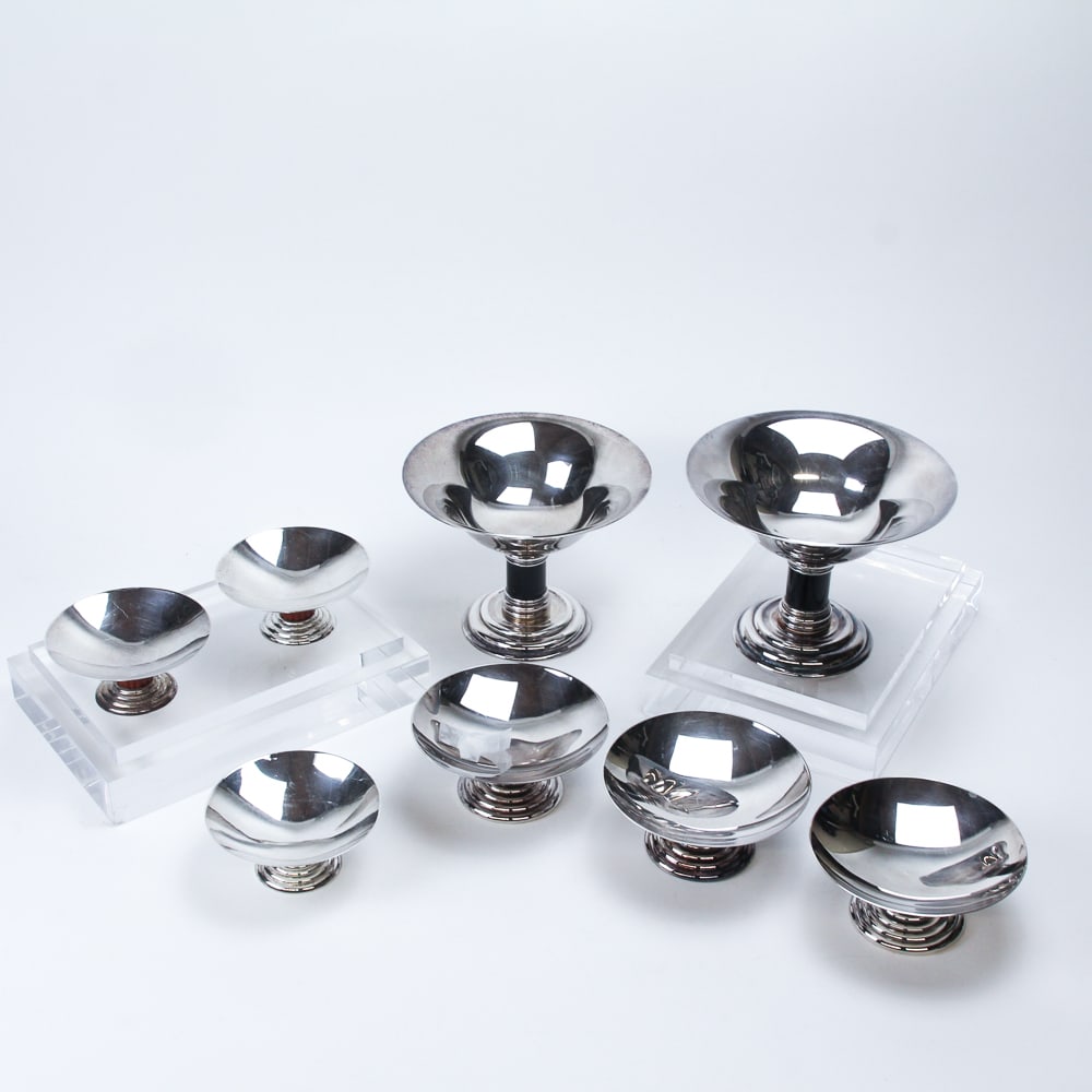 Jean Puiforcat Art Deco Silver Plate Garniture, 8: Jean Puiforcat eight piece art deco silver plate and faux stone garniture, each of compote / tazza form, with shallow bowl resting on a fluted column of faux stone - coral, jade, malachite, and black 