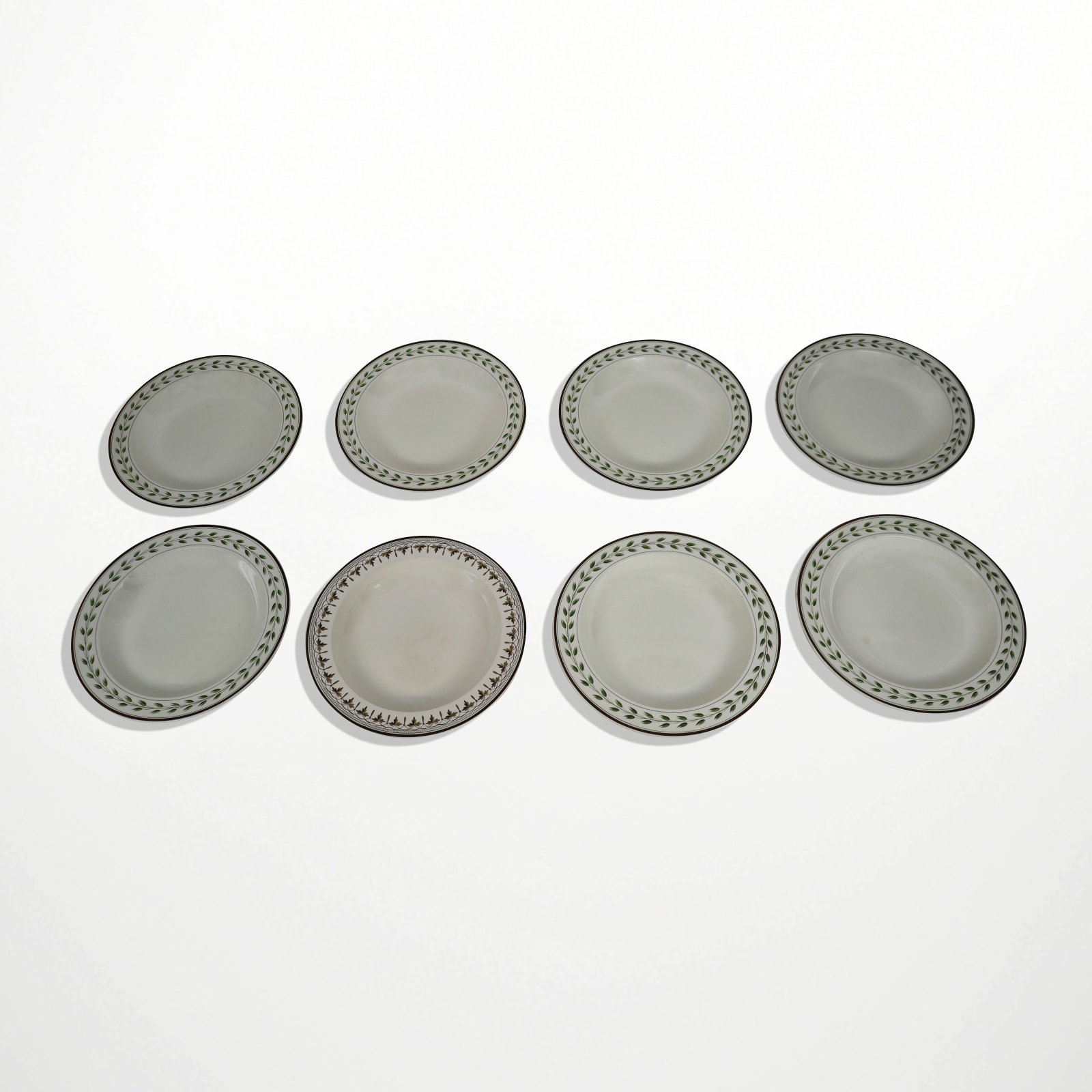 Wedgwood Collection of Creamware Plates, 8: Wedgwood collection of assorted creamware plates, English, late 18th/early 19th century, comprising one plate with brown and black foliate leaf and vine shall bowl, together with seven similar