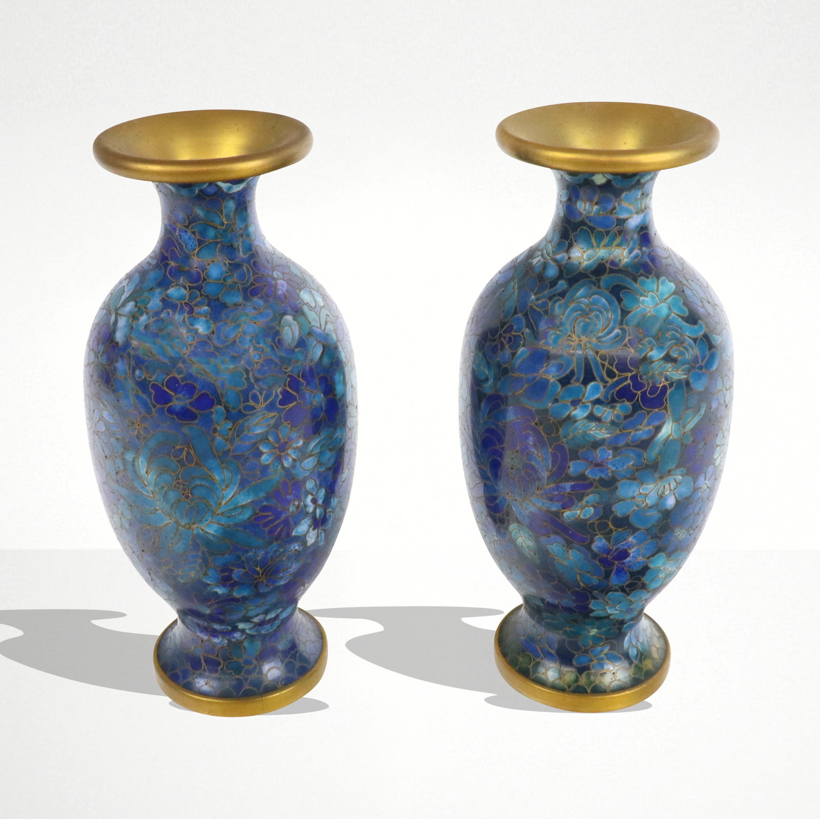 Pair of Japanese Shoto Jippo Cloisonne Vases: Pair of Japanese cloisonne vases, 20th century, in the shoto style with floral decoration in blue tones, unmarked. [7.5" H x 3.25" Diameter]. Condition to each is good.