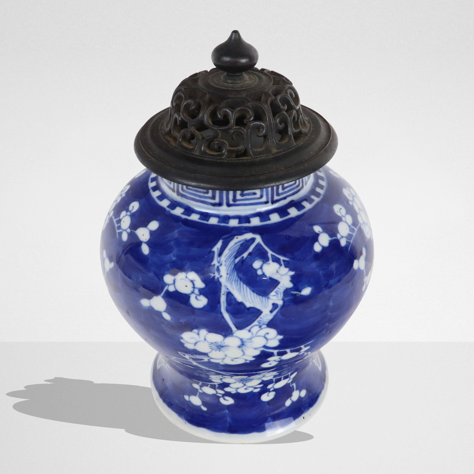 Chinese Qing Dynasty Blue and White Ginger Jar: Chinese blue and white porcelain ginger jar, Qing Dynasty, 19th century, with a possibly later reticulated wood lid, unmarked at base. [10.5" H x 7" Diameter]. Condition is good.