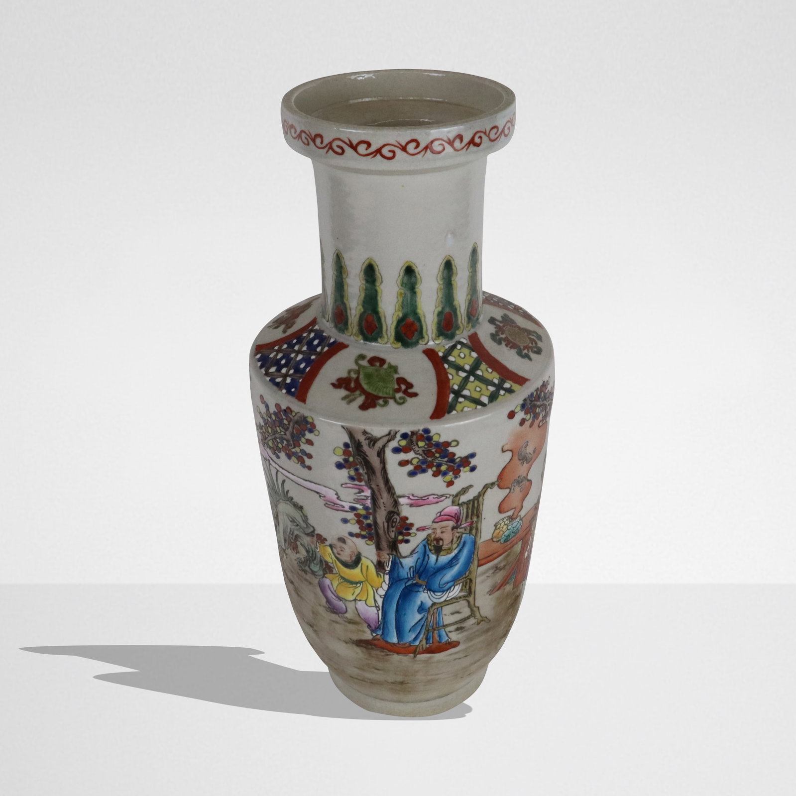 Chinese Famille Rose Export Porcelain Vase: Chinese Famille Rose export porcelain vase, Qing Dynasty, 19th century, with floral and figural decoration, with apocryphal Kangxi marks to base. [16" H x 7.5" Diameter]. Condition is good.
