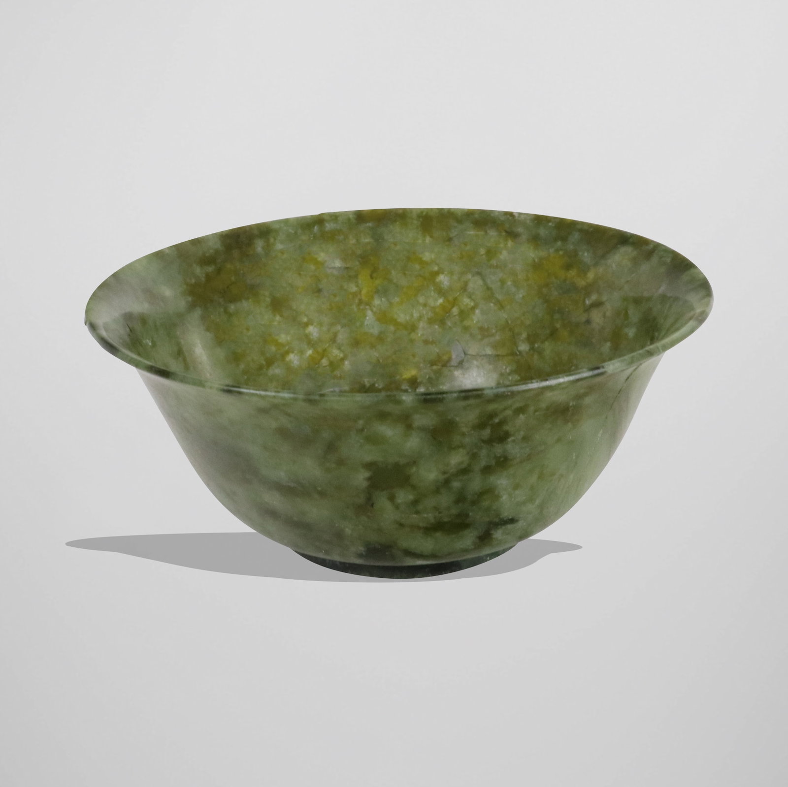 Chinese Jade Bowl: Chinese jade bowl. [2.25" H x 5" Diameter]. Condition is good with some cracks.