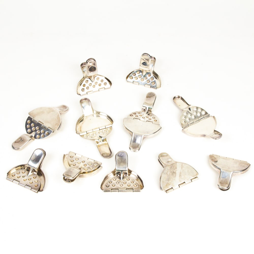 Set of Sterling Silver Lemon Squeezers, 11: Set of eleven sterling silver lemon squeezers, unmarked, tests for sterling silver. [Total 17.5 ozt., 1" H x 2.5" Square]. Overall condition is good, some with minor scratches.