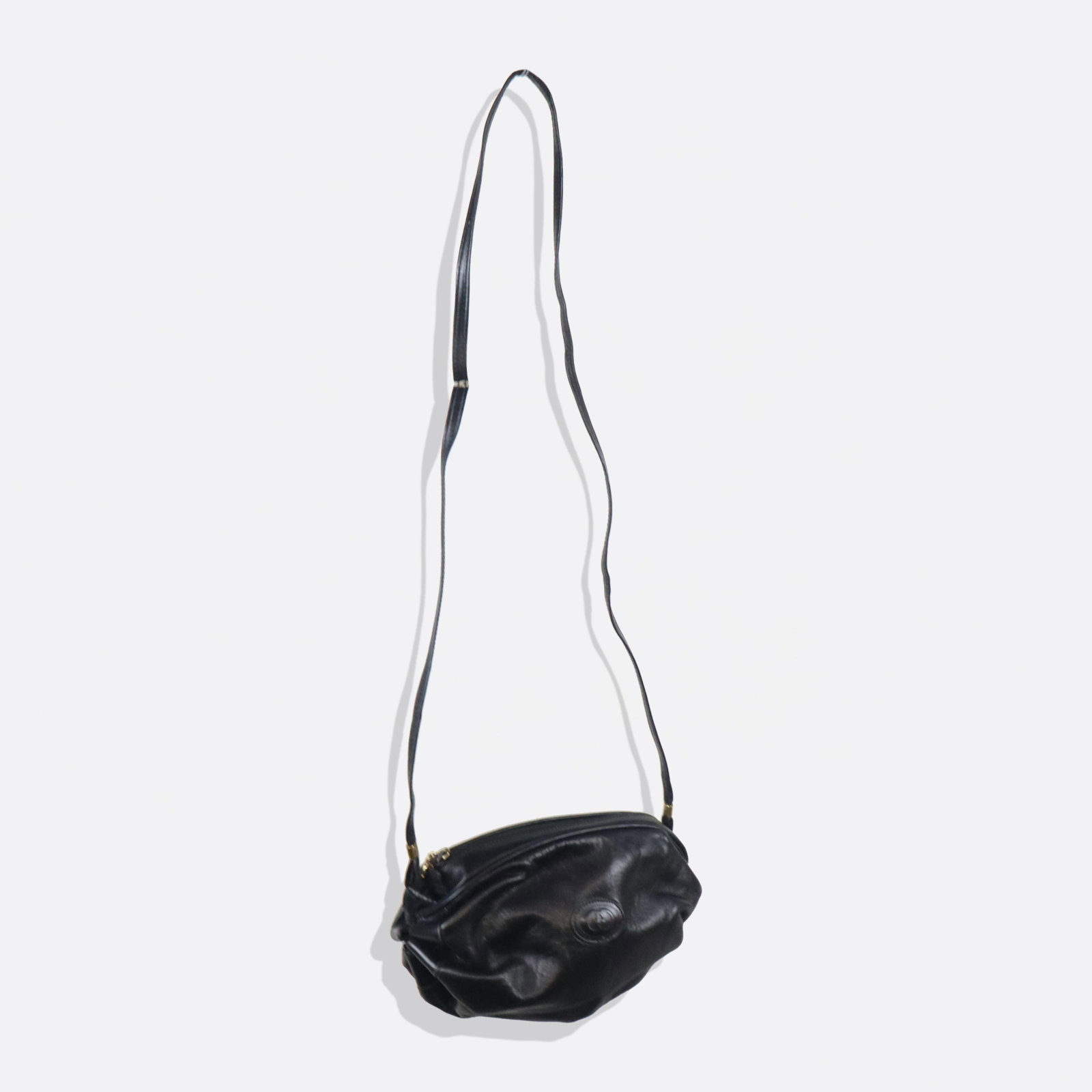 Gucci Pursed Leather Handbag: Gucci black leather handbag, 20th century, with puckered leather construction, with double G monogram to exterior, marked Gucci to interior and with double G decoration to hardware, accompanied by a d