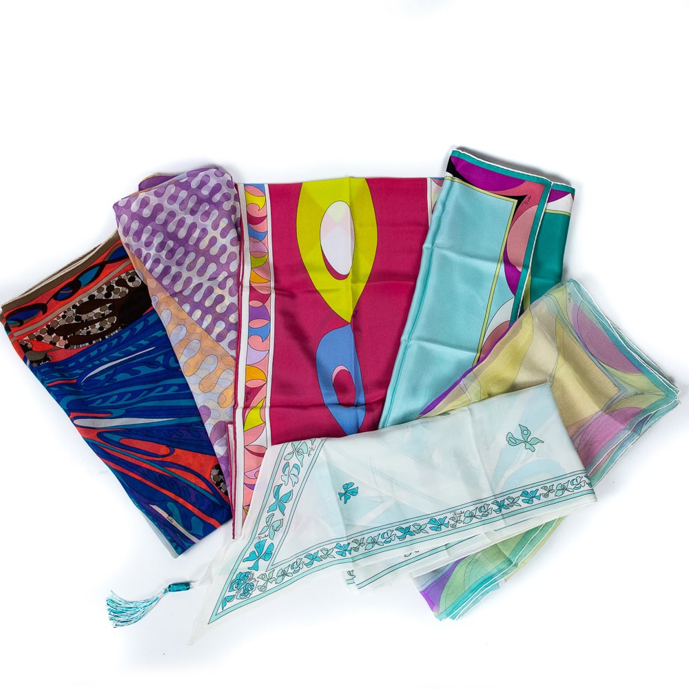 Six Pucci Scarves: Six Pucci scarves in various sizes including five silk chiffon scarves, all marked to labels, and further signed within print, accompanied by a Pucci box. [Largest: 36" Square]. Condition throughout i