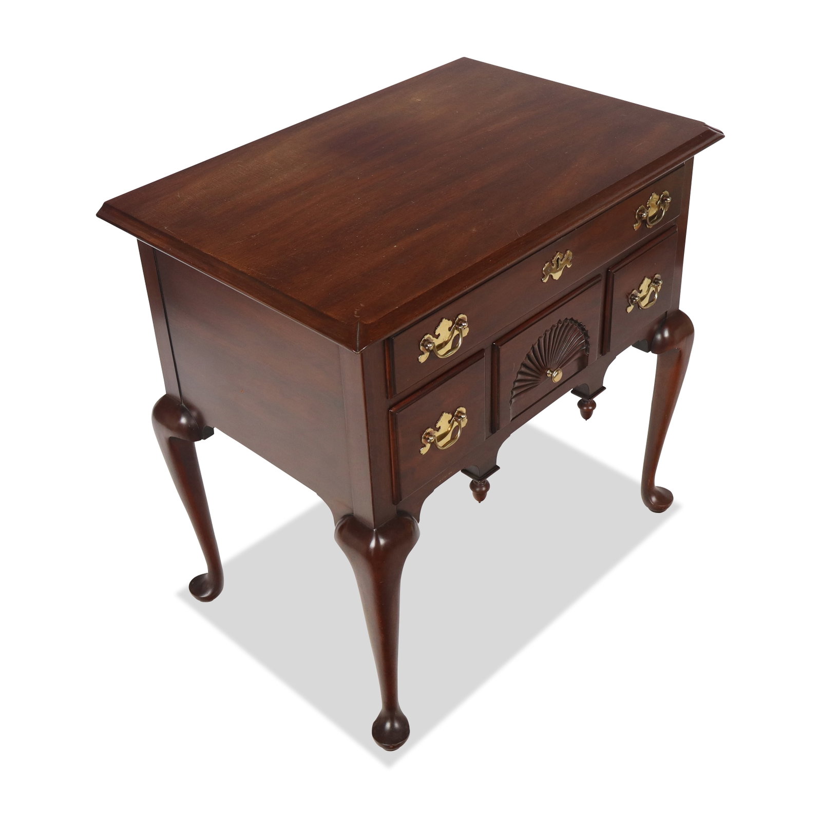 Virginia Galleries Mahogany Lowboy: Virginia Galleries mahogany lowboy, 20th century, with a brass mounted long drawer over three short drawers, on four pad-footed cabriole legs, marked to interior upper drawer. [30" H x 31" W x 21" D].