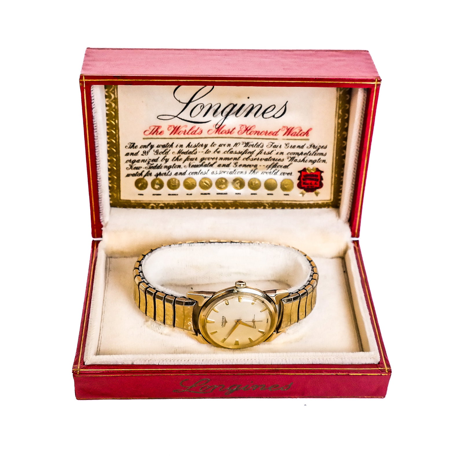 Vintage Longines Wristwatch: The 10K gold filled case attached to a Spidel metal band, dial signed Longines Swiss, in original fitted box. UPSTAIRS OFFICE