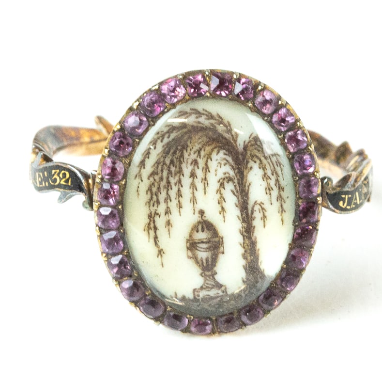 George III Amethyst, Enamel & Gold Memorial Ring: George III enamel, amethyst and gold memorial ring, Probably English, 1778, the black enamel band inscribed "Janet Smith O.B.: 18 Jan:1778 A.E.: 32" and accented with a border of amethyst framing a we