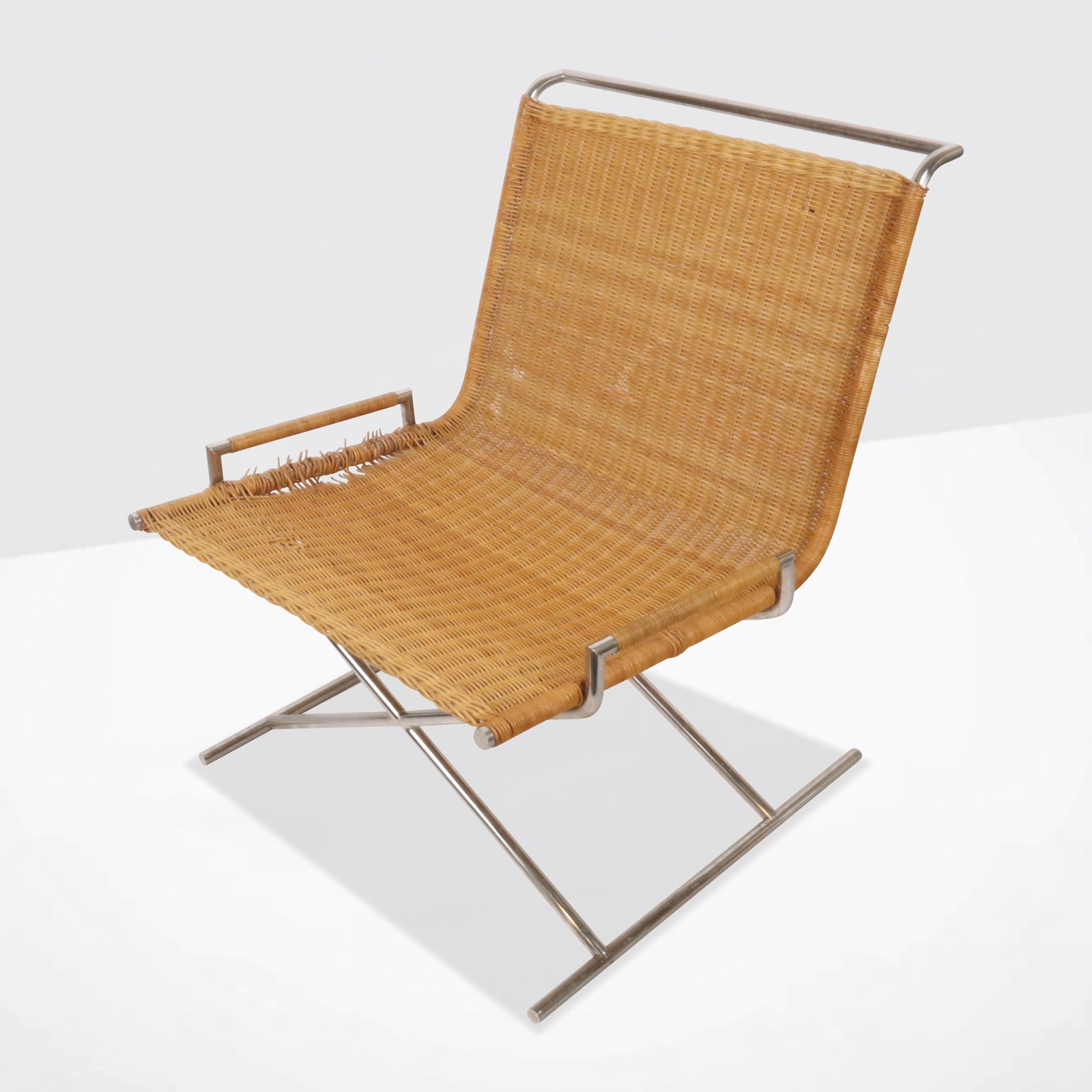 Ward Bennet Designed "Sled" Lounge Chair: Ward Bennet designed chromed, bamboo & rush "Sled" lounge chair, unmarked. [31" H x 27" W x 33" D]. Overall condition is fair, as the rush needs to be replaced.