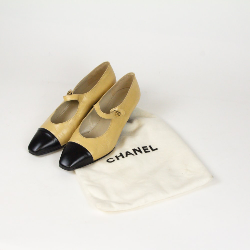 Chanel Lambskin Mary Janes: Chanel lambskin Mary Janes, 20th century, with two tone leather, with double C to gold tone hardware at strap, and Chanel Made in Italy to soles and inner, with Chanel dustbag. [Size: EU 38]. Conditio