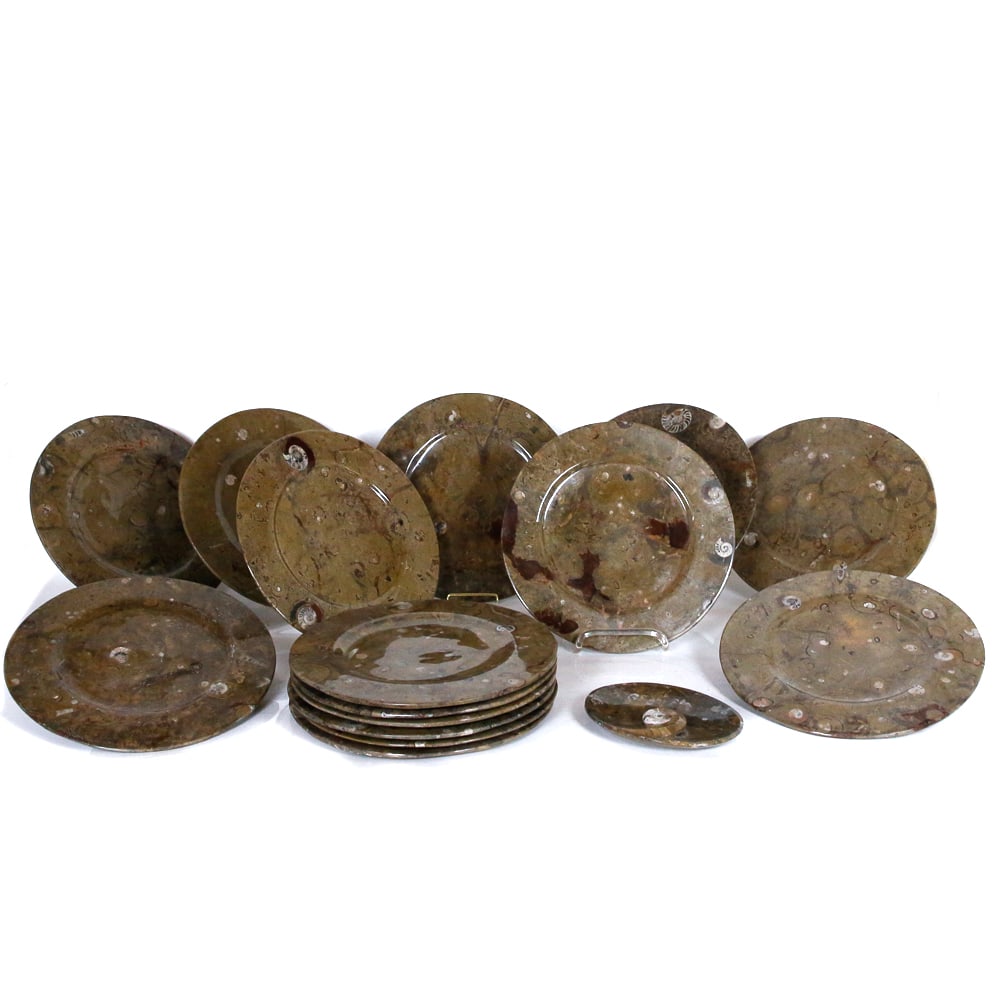Set of Fossilized Marble Service Plates, 16: Set of fossilized brown marble service plates, comprising fifteen service plates [12.25" Diameter], and an oval condiment dish [7.5" L x 5.5" W]. Overall condition is good.