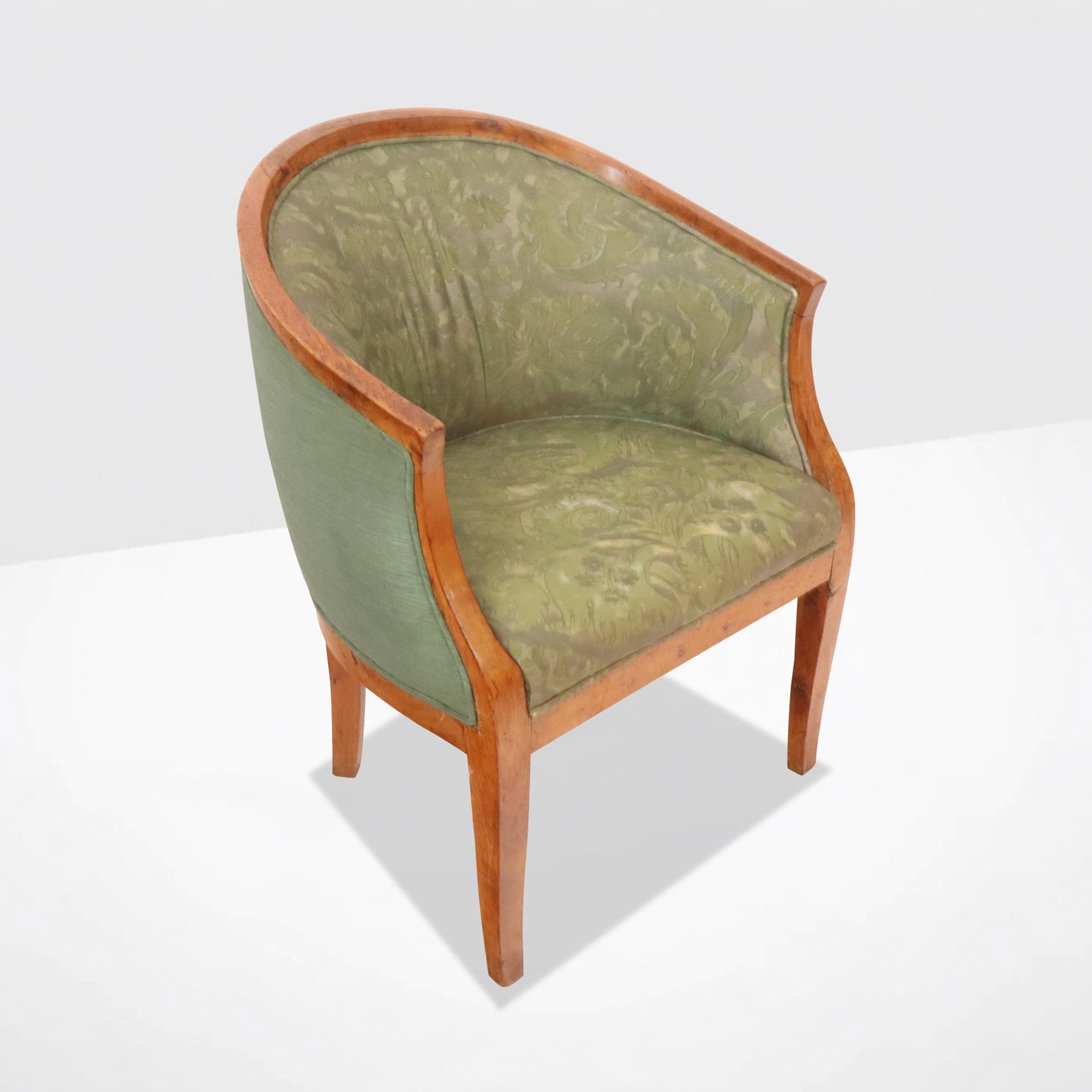 Biedermeier Scoop Back Bergere: Antique oak barrel back chair with green upholstery. [26.5" H x 20.5" W x 17" D; 15.5" H to seat]. Condition is fair with upholstery needing replacement.