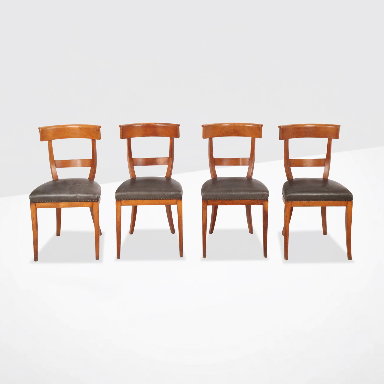 Set of Four Biedermeier Side Chairs: Set of four Biedermeier side chairs, antique chairs with black upholstery and marble nailhead trim. [33.5" H x 18" W x 18.5" D; 18.5" H to seat]. Condition is good.
