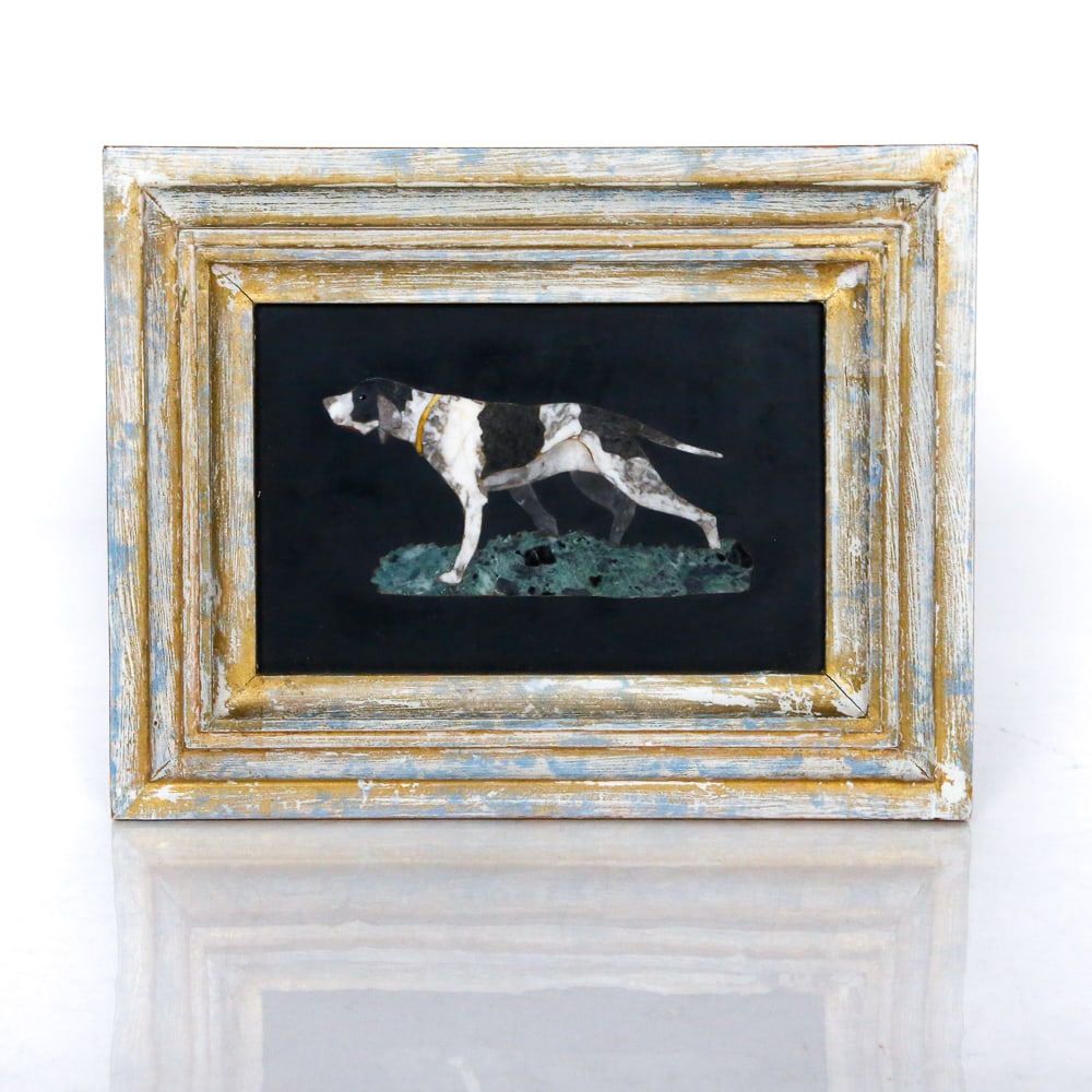 G. Ugolini Pietra Dura of a Dog: G. Ugolini Pietra dura of a dog, later 20th century, in a gilt frame with label to verso. [Framed: 6.5" H x 8.5" W]. Condition is good with minor wear and a repair to frame.