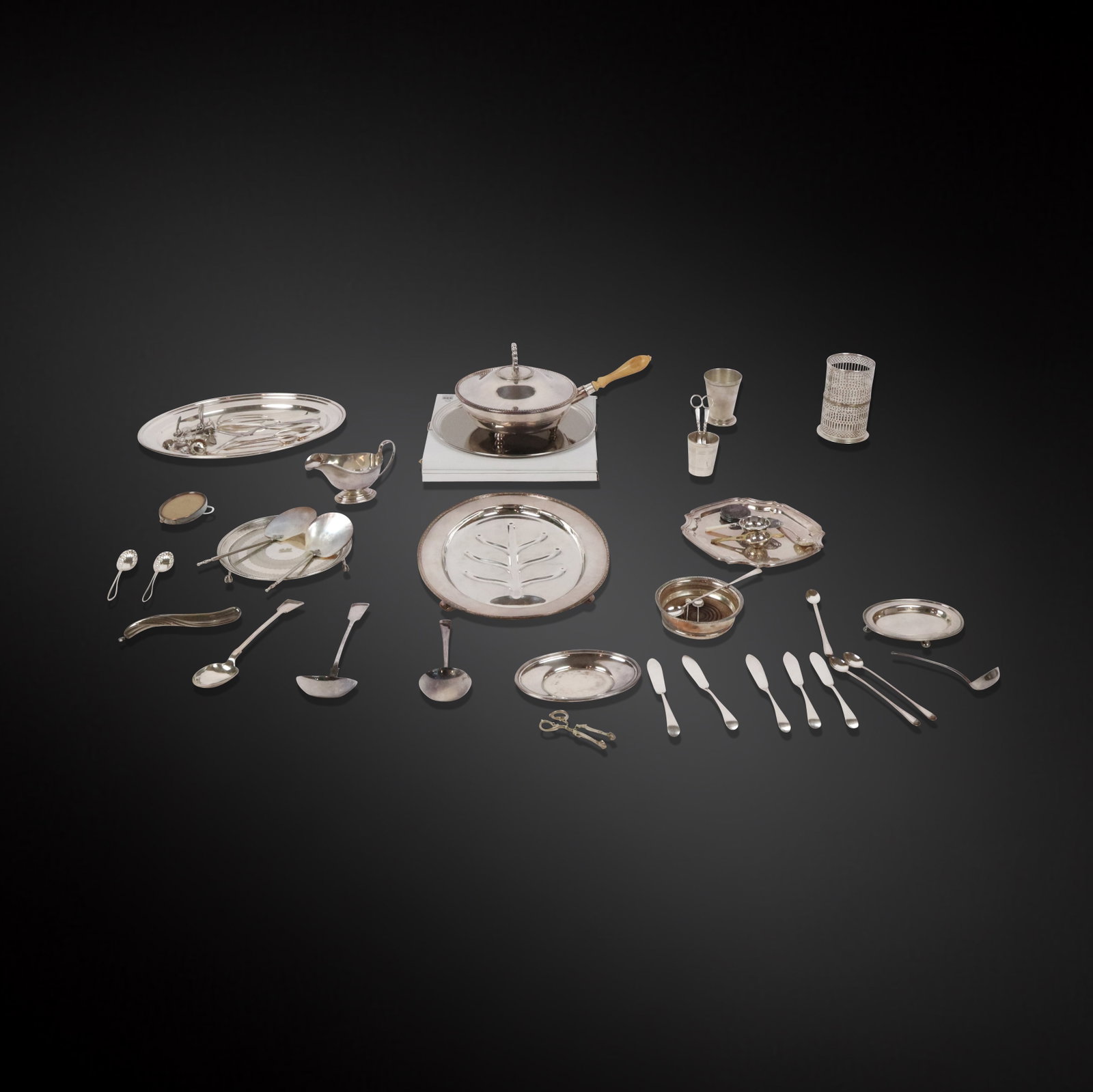 Group of Assorted Silver Plate & Metal, 30+: Group of assorted silver plate and metal articles, comprising well and tree platter, platter, two salvers, vegetable server, frames, tea strainers, gravy boat and undertray, wine coaster, assorted fla