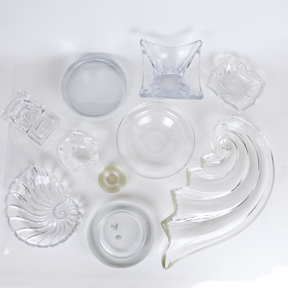 Tiffany, Vetri, Mikasa Et. Al Glass Objects, 10: Collection of high design and signed colorless glassware, comprising Mikasa wave serving dish (unsigned) [3" H x 18" W x 10" D], mid-century modern candlestick / match strike with engine turned