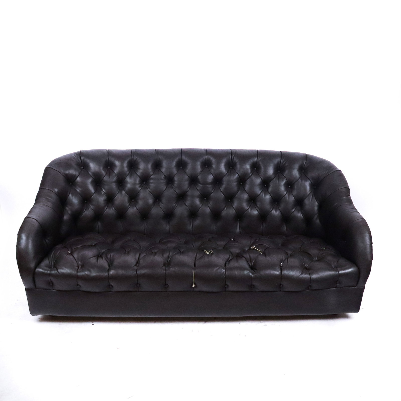Leather Chesterfield Sofa Loveseat: Leather Chesterfield sofa loveseat, 20th century, with tufted design, unmarked. [31.75" H x 75.5" W x 32" D; seat height: 15"]. Condition is good to fair with some wear to upholstery and losses to but