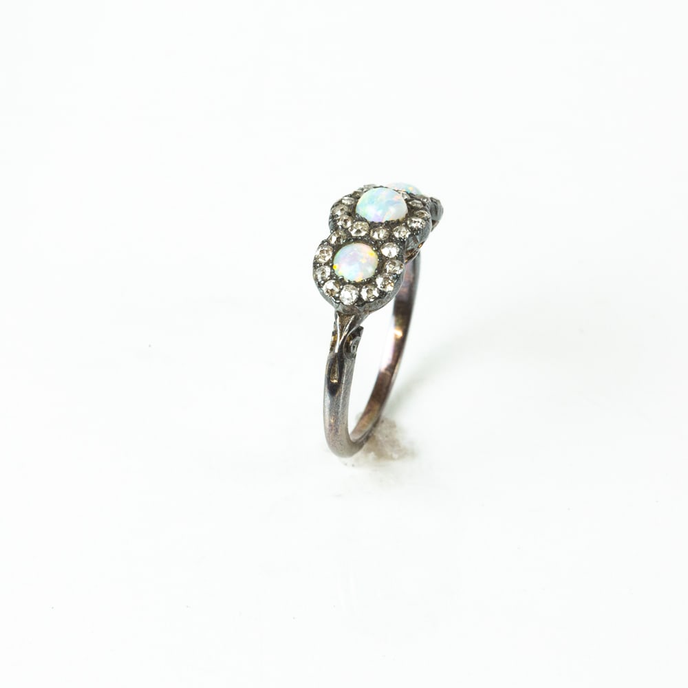 Victorian Opal & Diamond Ring: Victorian old mine diamond, opal and silver topped yellow gold ring, probably English, the arched top set with three small cabochon opal and diamond clusters, unmarked, tests for 14K gold. [1.78 dwt.,
