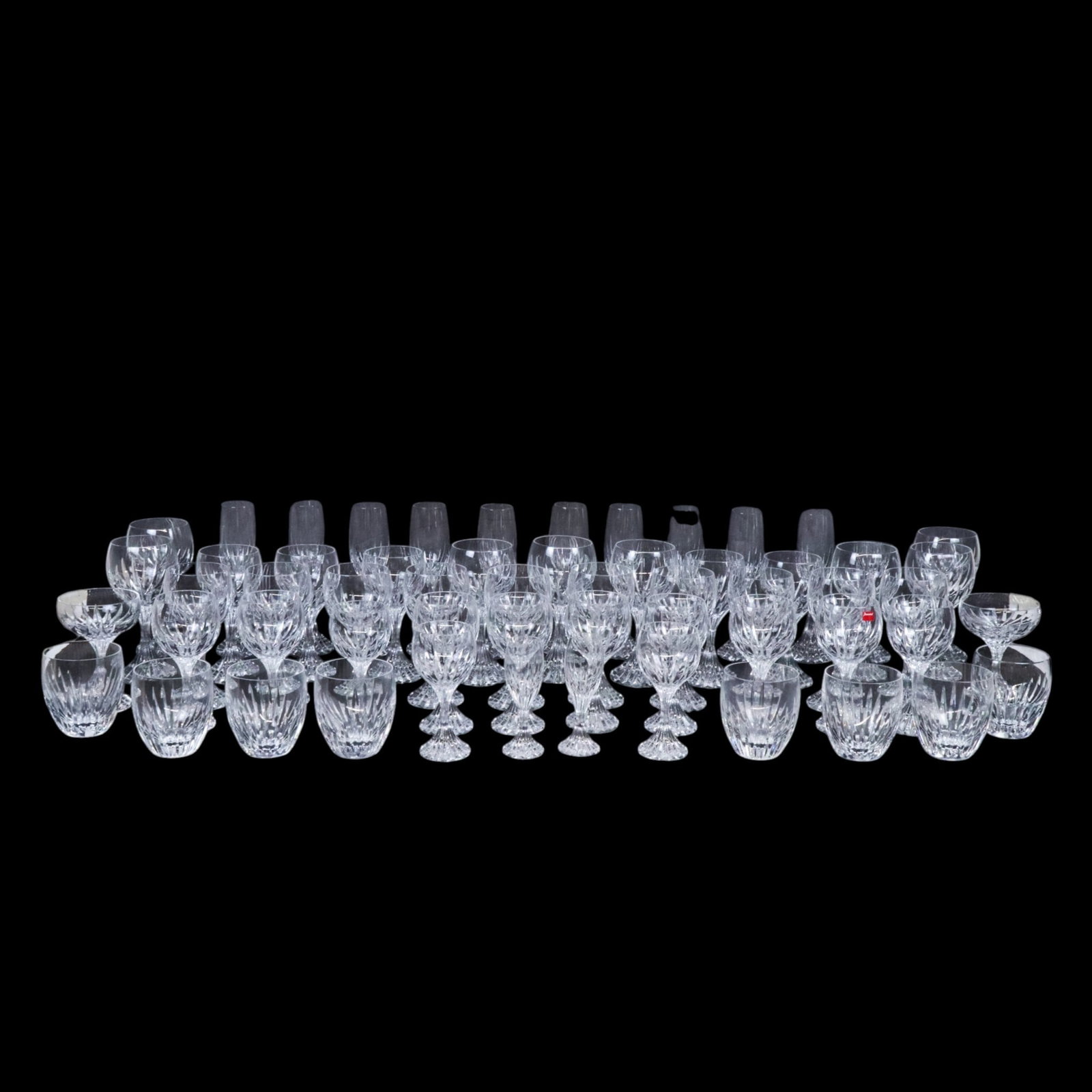 Baccarat Crystal "Massena" Stemware, 73: Baccarat crystal "Massena" pattern stemware, comprising two cordials, eleven champagne flutes, two champagne saucers, eleven red wine glasses [7.5" H x 3.25" Diameter], eighteen water glasses [7" H x 