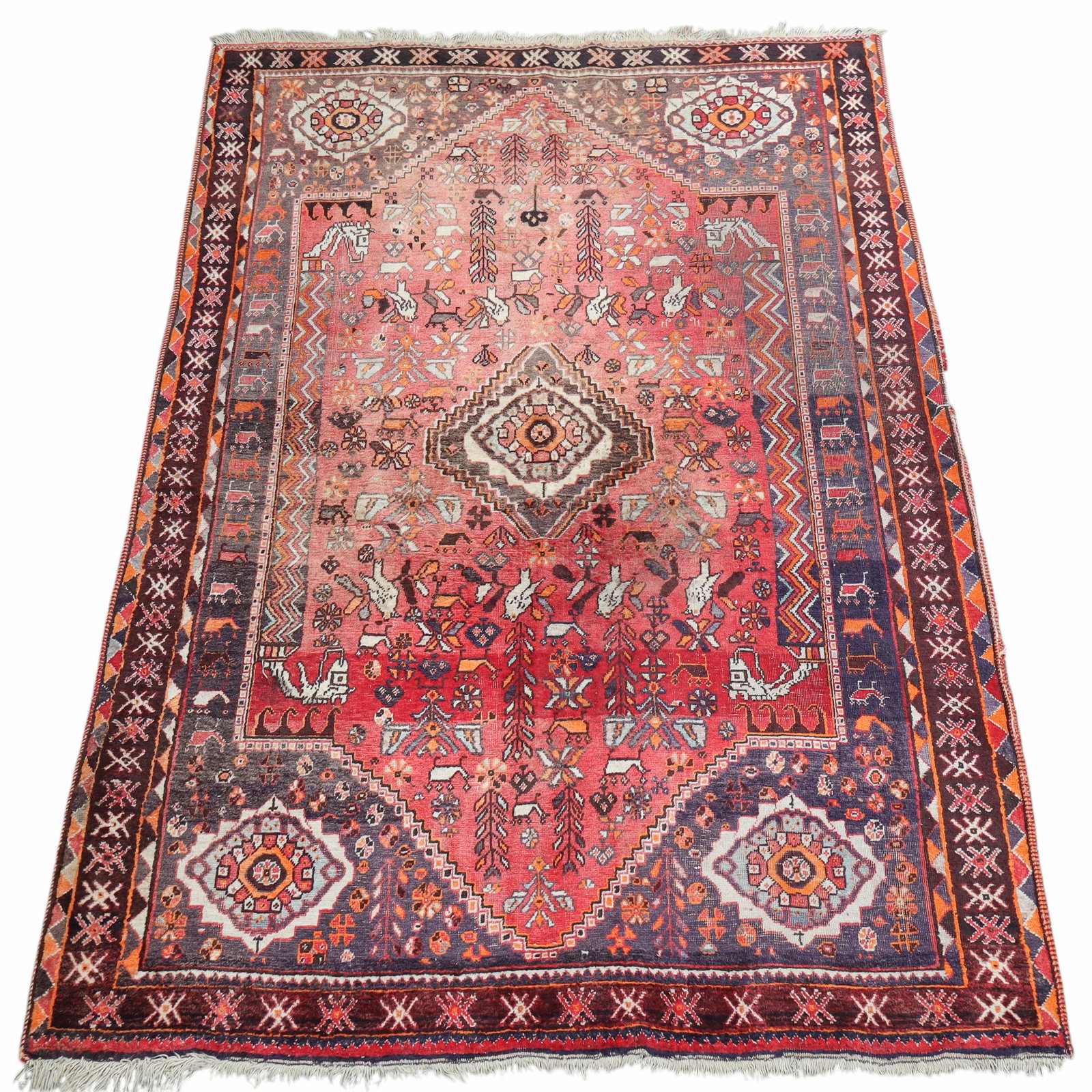 Persian Shiraz Style Rug: Persian Shiraz style rug, having bird and geometric designs. [95" L x 60" W]. Many areas of low pile.
