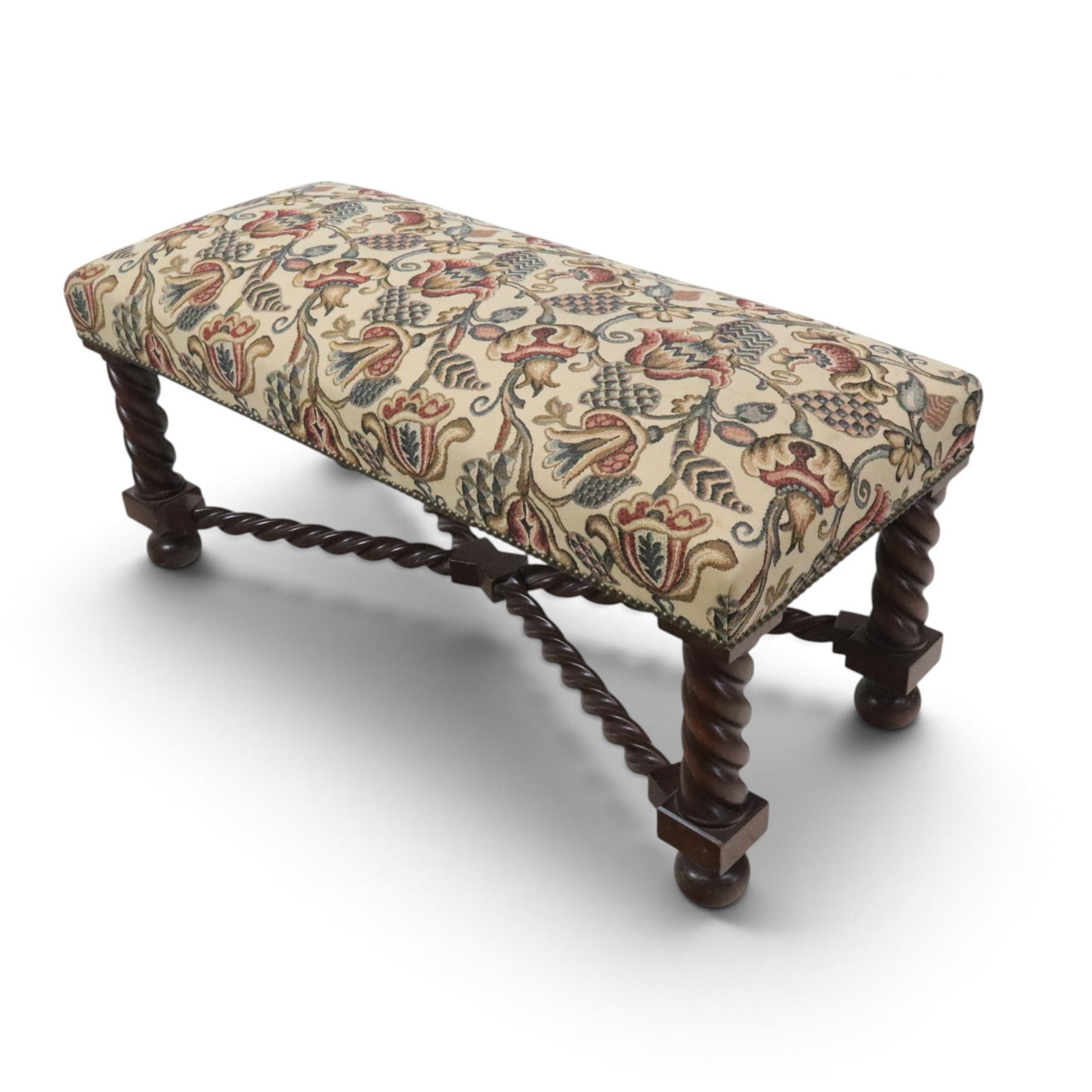 Jacobean-Style Window Bench: Jacobean-style bench having a twist-form base below a decorated seat, on bun feet, 20th century. [19.5" H x 45" W x 19" D].