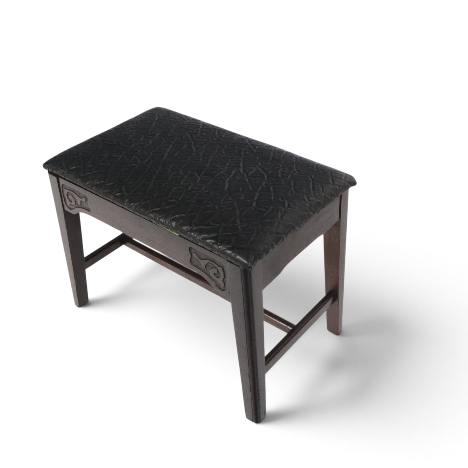 Carved Oak Embossed Leather Upholstered Bench: Carved oak embossed leather upholstered bench, Probably French, 1940s, with swirl designs. [18" H x 23" W x 14.5" W]. Overall good condition.